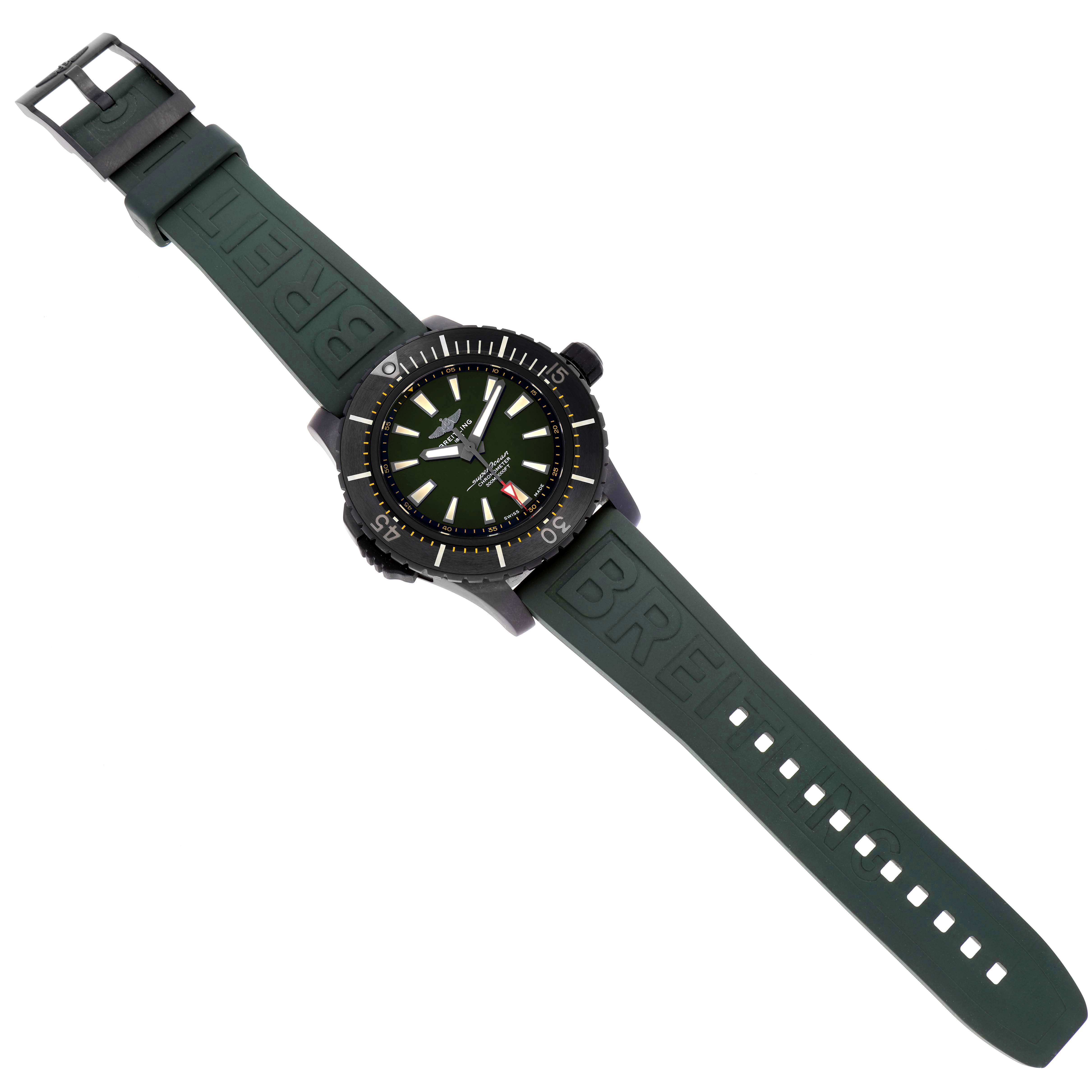 The image shows a Superocean model by Breitling from a top-down angle, featuring its green dial and rubber strap.