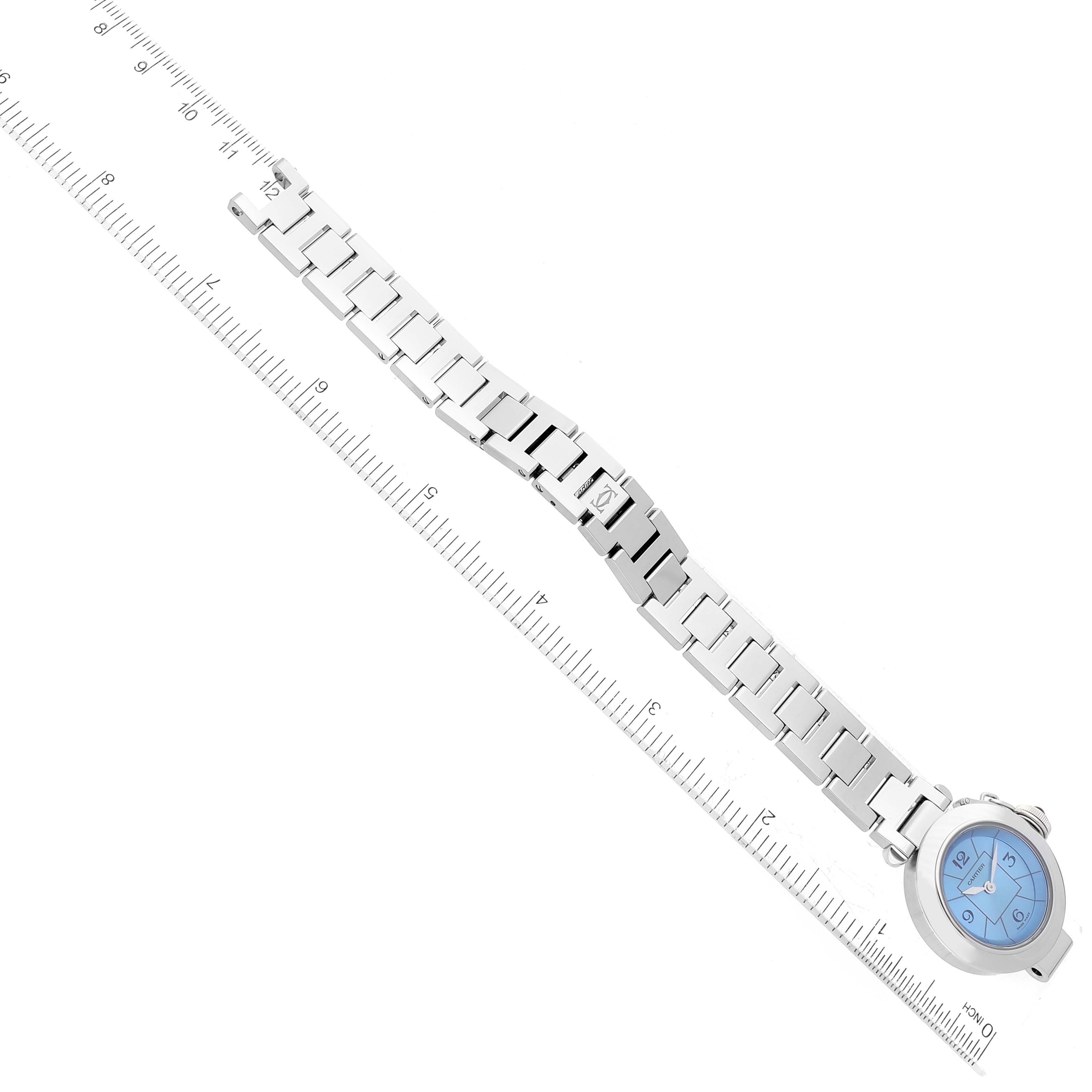 The image shows a Cartier Pasha W3140024 Women's Stainless Steel Blue Dial W3140024 Women's Stainless Steel Blue Dial watch positioned horizontally with a ruler beside it, highlighting the strap and blue dial.