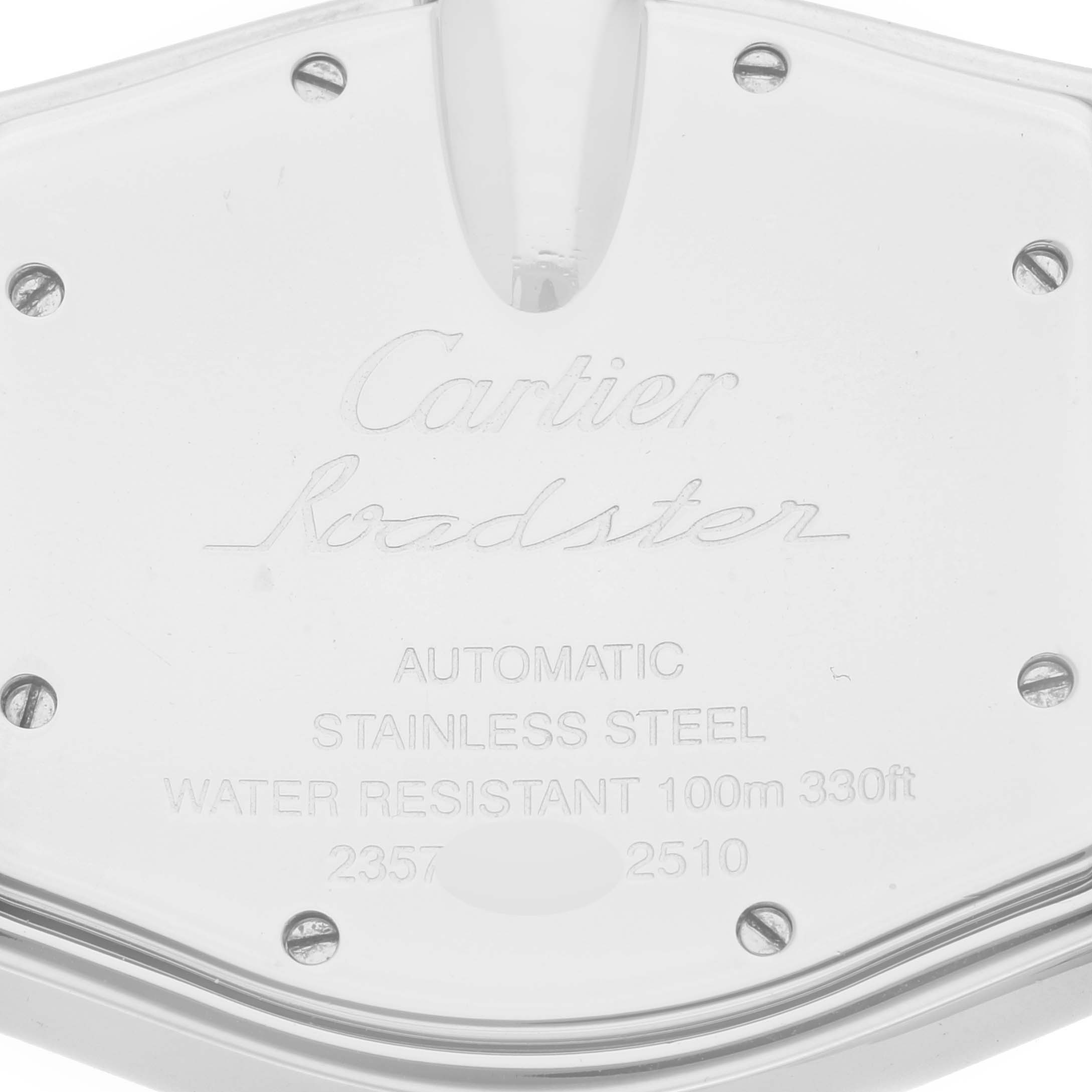 Close-up of the backplate of a Cartier Roadster W62025V3 Men's Stainless Steel Silver Dial W62025V3 Men's Stainless Steel Silver Dial watch, showing engravings and screws.