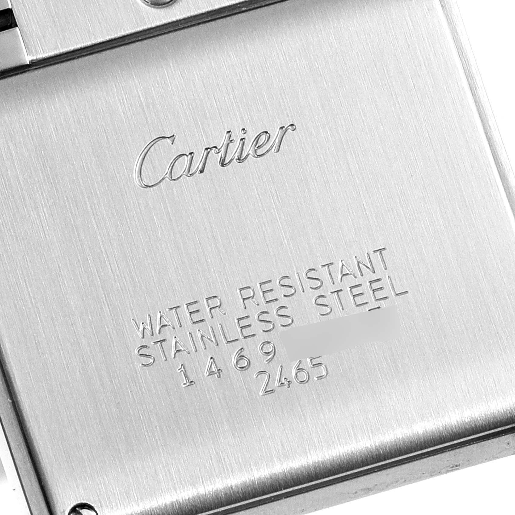 The image shows the stainless steel back casing of a Cartier Tank Francaise W51011Q3 Women's Stainless Steel Silver Dial W51011Q3 Women's Stainless Steel Silver Dial watch, highlighting its water resistance.