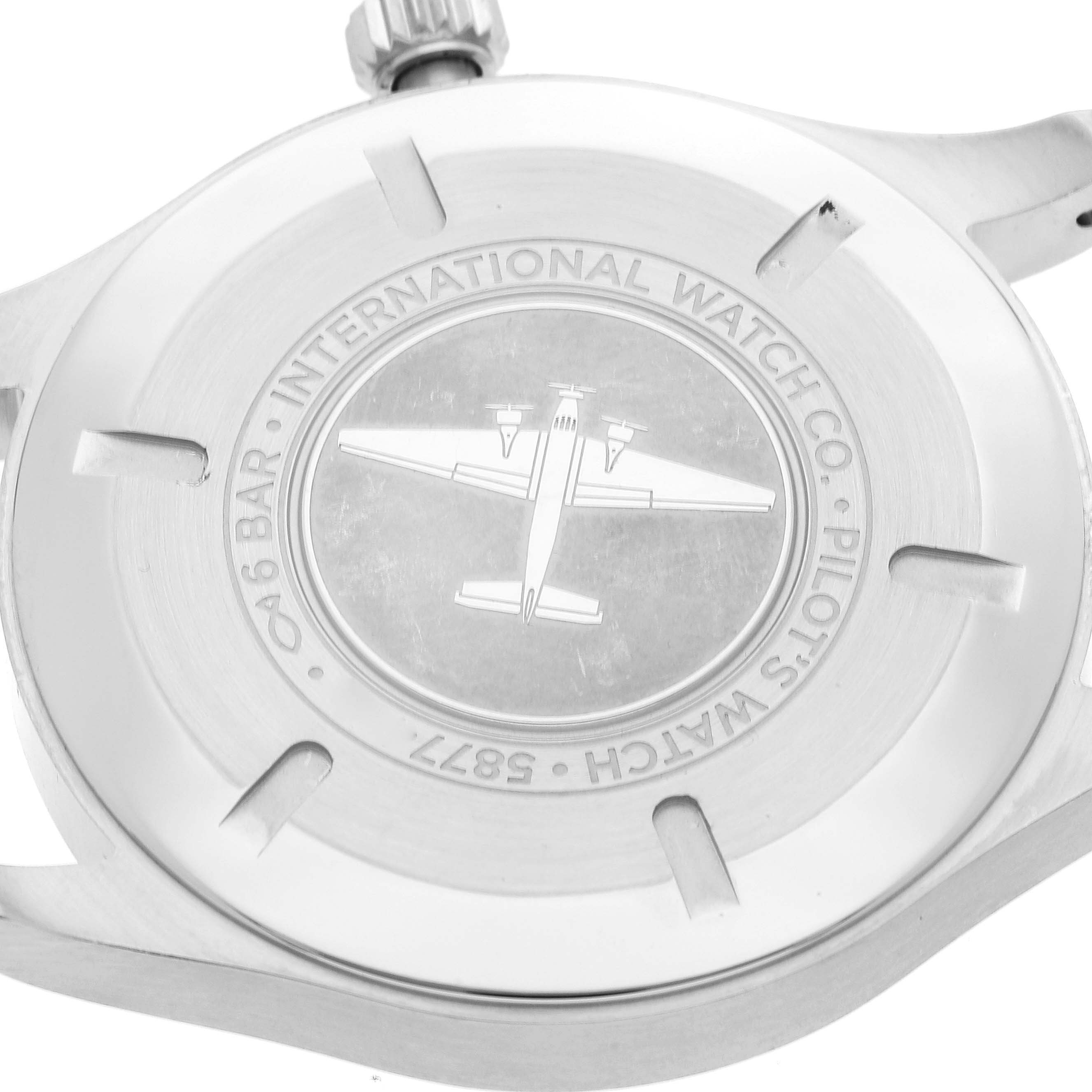 The image shows the back case of the IWC Pilot IW327015 Men's Stainless Steel Black Dial IW327015 Men's Stainless Steel Black Dial model watch, featuring an engraved airplane and brand details.