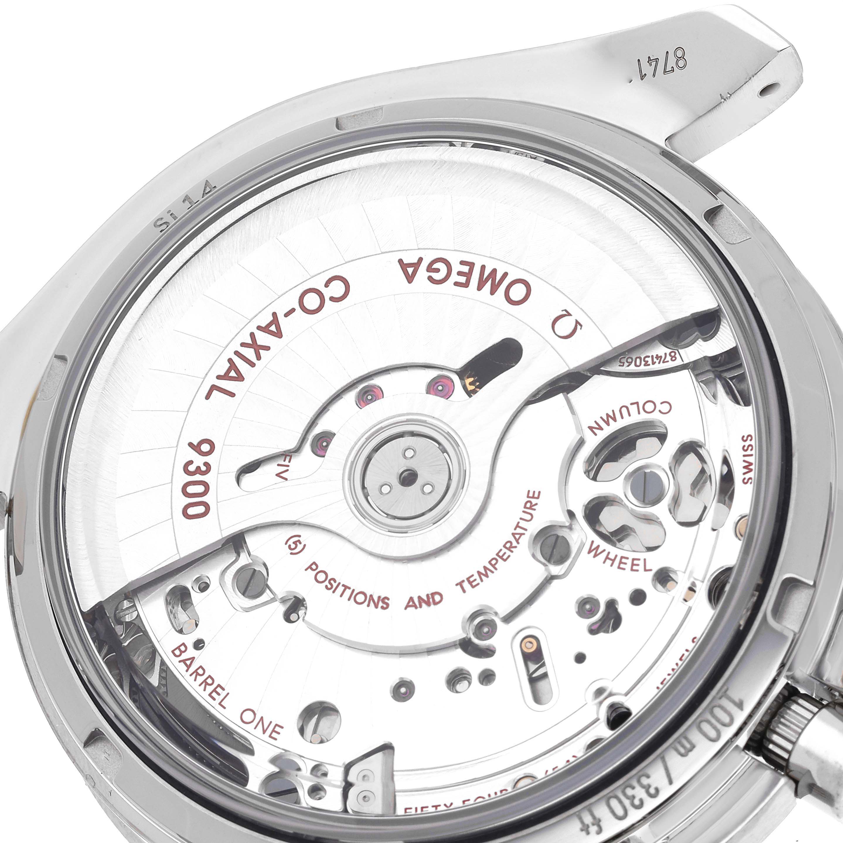 The image shows the rear view of an Omega Speedmaster 311.93.44.51.03.001 Men's Titanium Blue Dial 311.93.44.51.03.001 Men's Titanium Blue Dial watch, highlighting its Co-Axial 9300 movement mechanism.