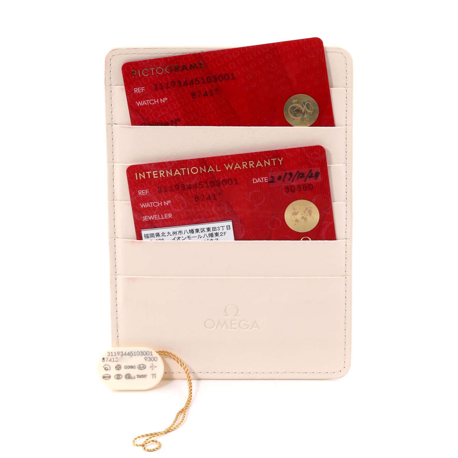 The image shows an Omega Speedmaster 311.93.44.51.03.001 Men's Titanium Blue Dial 311.93.44.51.03.001 Men's Titanium Blue Dial warranty cardholder with pictogram and international warranty cards.