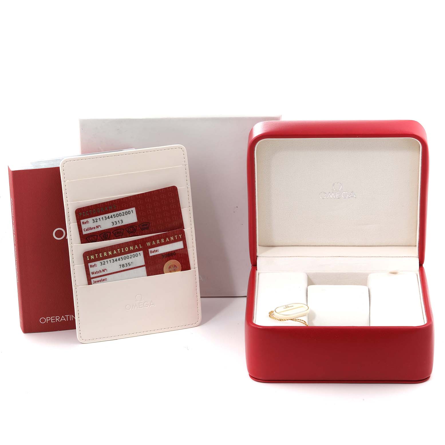 The image shows the box, warranty cards, instruction booklet, and packaging for an Omega Speedmaster 321.13.44.50.02.001 Men's Stainless Steel Red Dial 321.13.44.50.02.001 Men's Stainless Steel Red Dial watch.