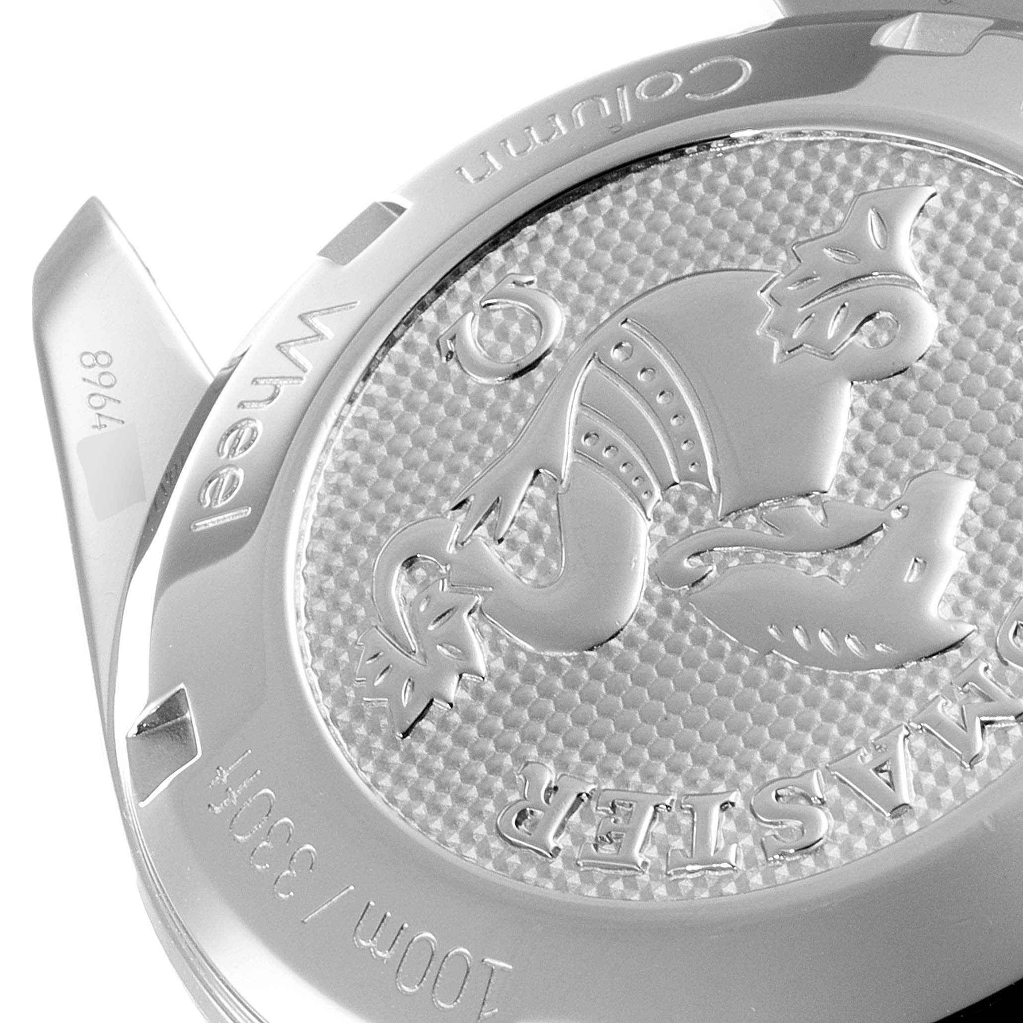 The image shows the back case of an Omega Speedmaster 324.30.38.50.03.001 Men
s Stainless Steel Blue Dial 324.30.38.50.03.001 Men
s Stainless Steel Blue Dial watch, featuring an engraved emblem and text detailing the model and specifications.