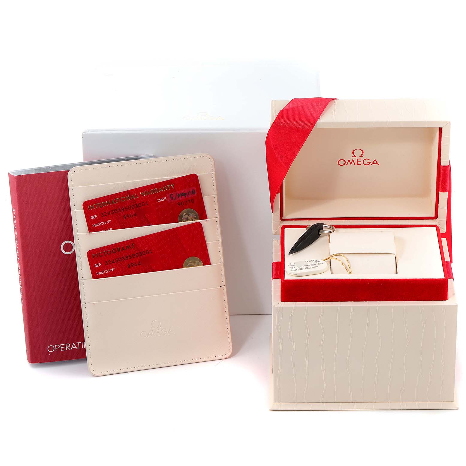 The image shows the Omega Speedmaster 324.30.38.50.03.001 Men
s Stainless Steel Blue Dial 324.30.38.50.03.001 Men
s Stainless Steel Blue Dial watch box, cards, and an instruction manual at a slight angle.