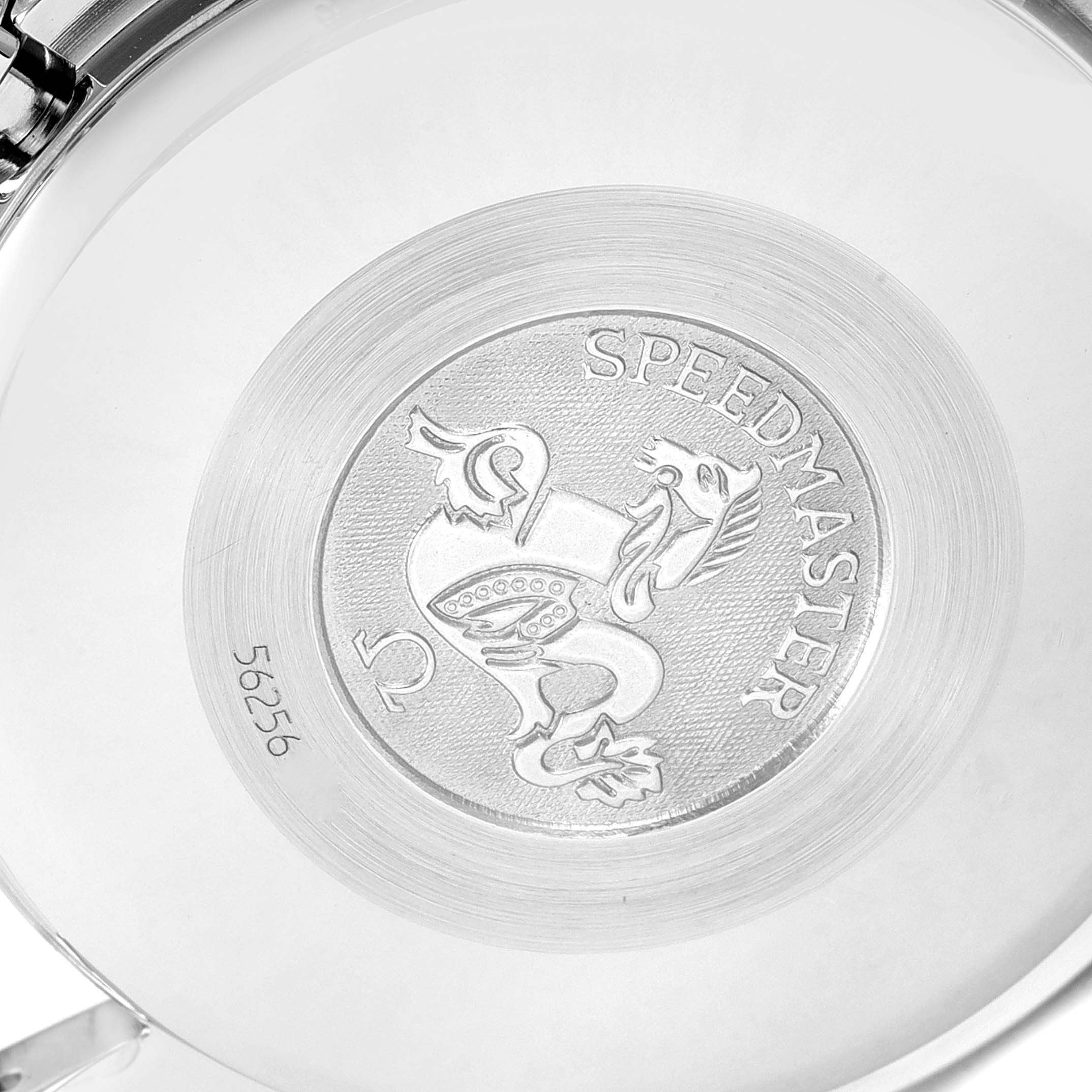 This image shows the backside of an Omega Speedmaster 3520.50.00 Men's Stainless Steel Black Dial 3520.50.00 Men's Stainless Steel Black Dial watch, highlighting its engraved emblem and model name.