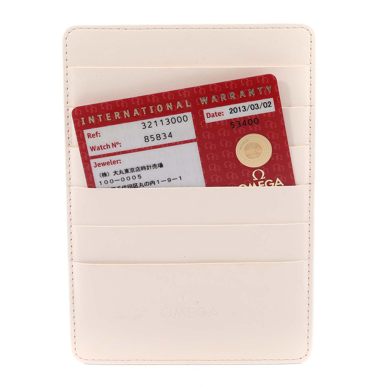 The image shows an Omega Speedmaster 3211.30.00 Men's Stainless Steel Silver Dial 3211.30.00 Men's Stainless Steel Silver Dial warranty card inside a white cardholder.