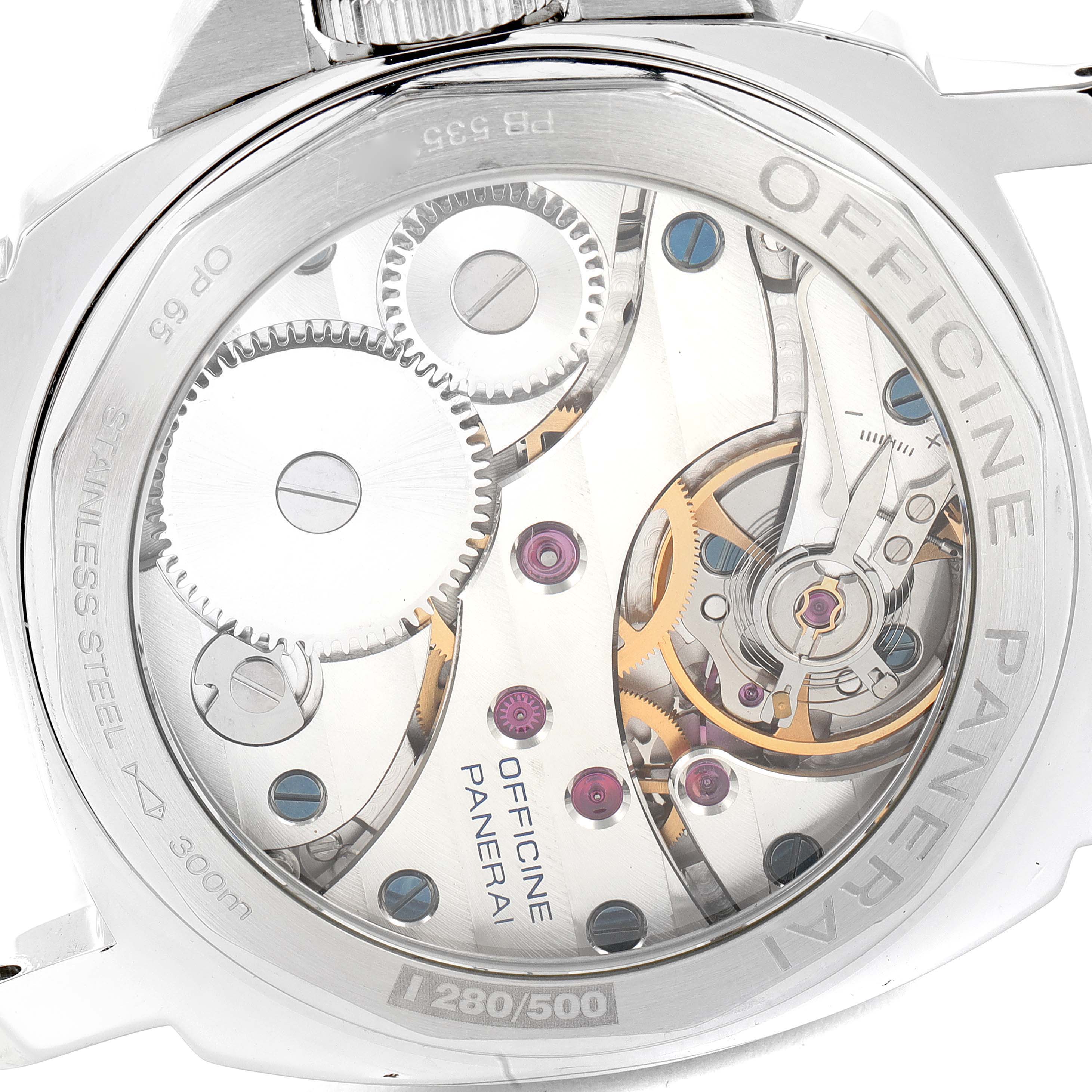 The image shows the backside of a Panerai Luminor PAM00114 Men
s Stainless Steel White Dial PAM00114 Men
s Stainless Steel White Dial watch, revealing its intricate mechanical movement and inner components.