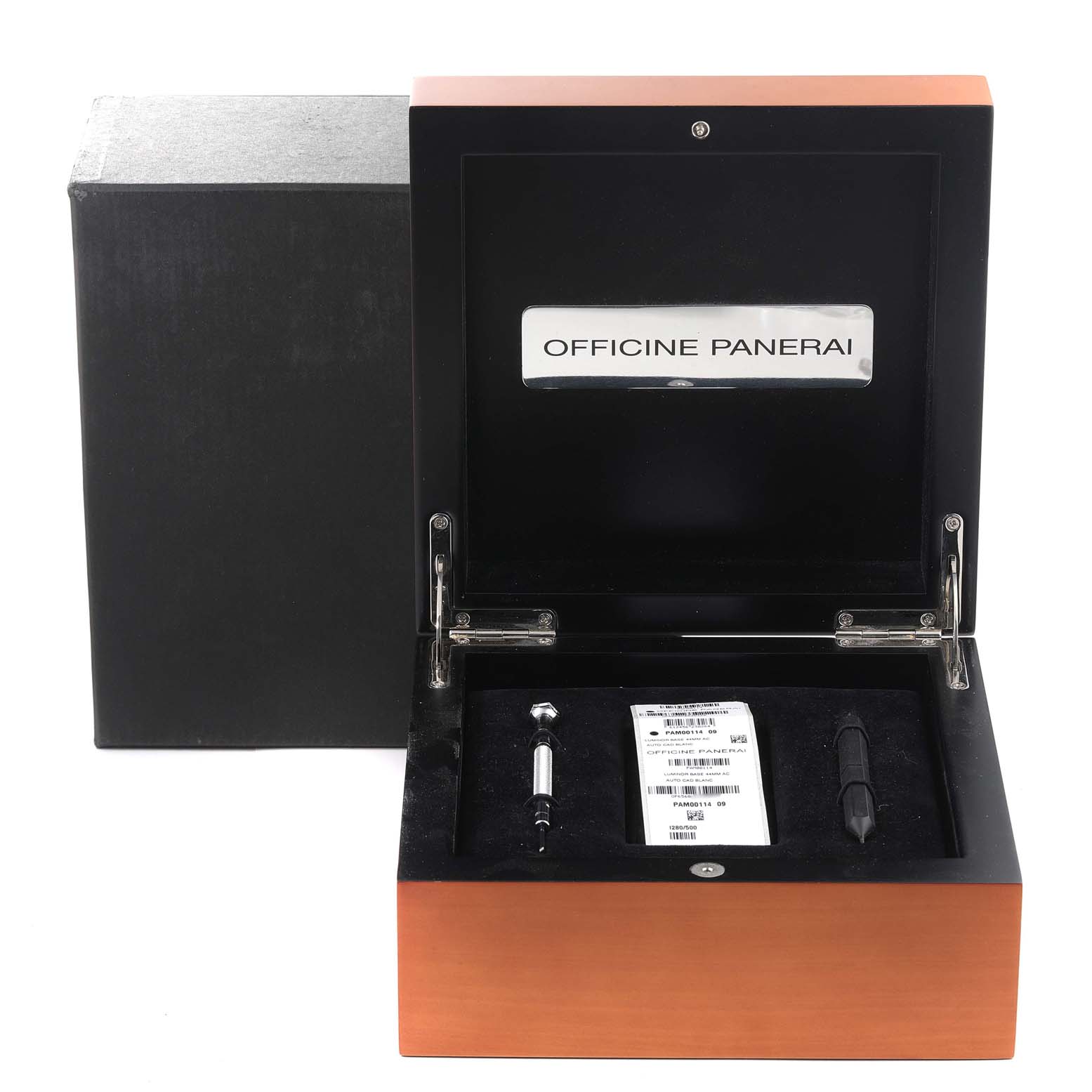 The image shows an open presentation box for a Panerai Luminor PAM00114 Men
s Stainless Steel White Dial PAM00114 Men
s Stainless Steel White Dial watch, displaying tools and a booklet inside.