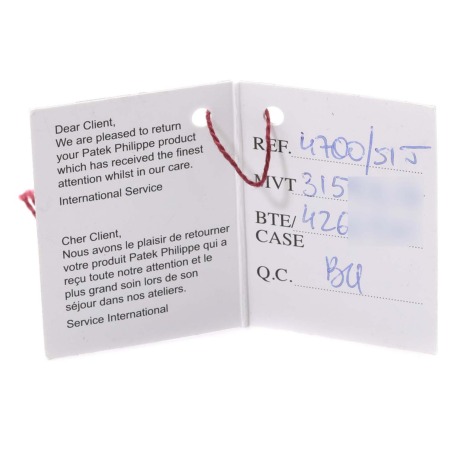 This image shows the service and inspection tag for a Nautilus model by Patek Philippe, viewed fully open.