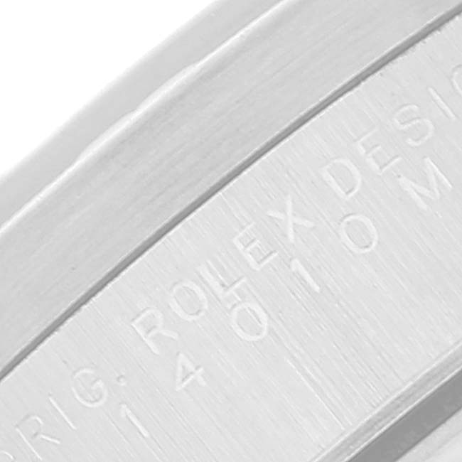 This close-up image shows the engraved bezel of a Rolex Air-King 14010 Men's Stainless Steel Blue Dial 14010 Men's Stainless Steel Blue Dial watch.
