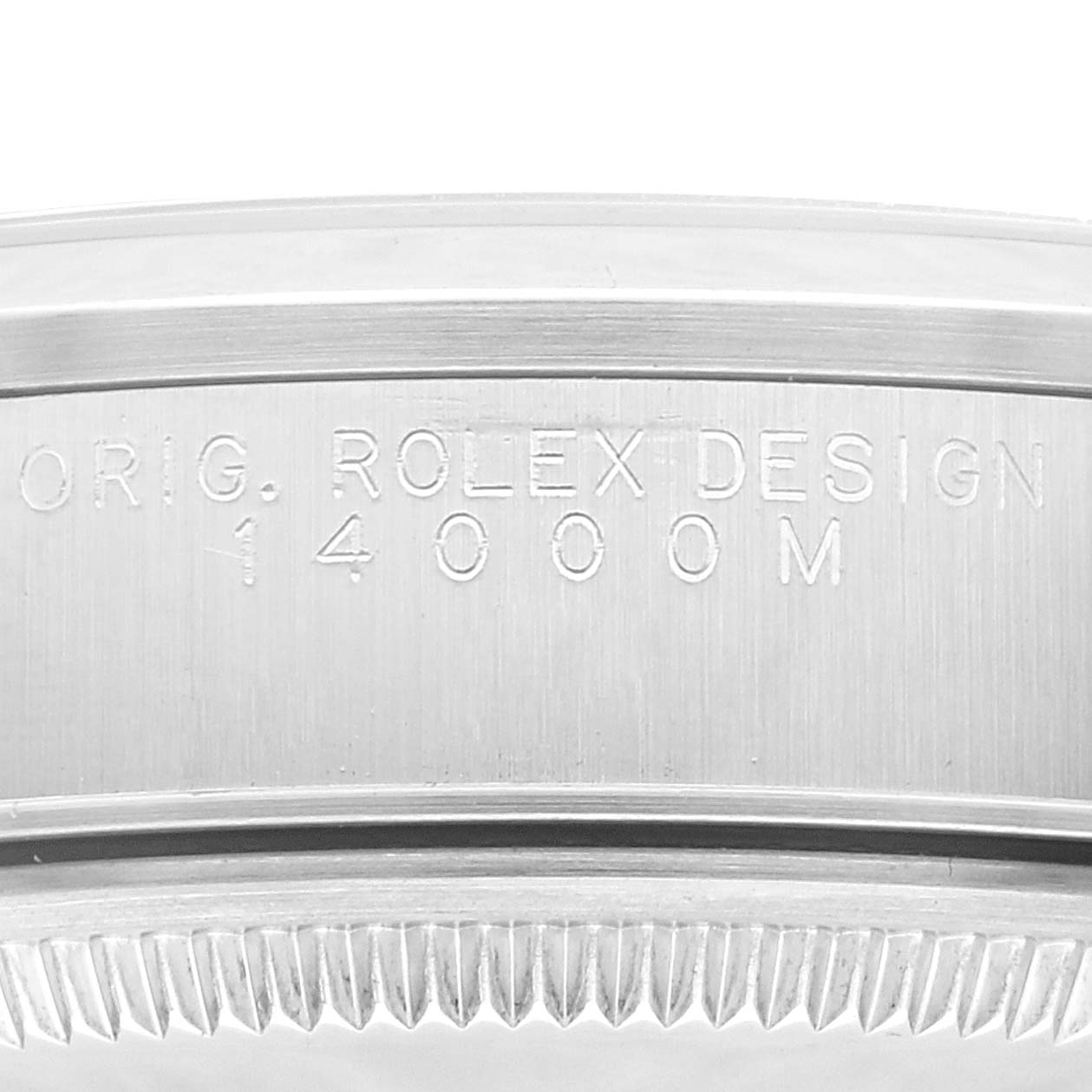 This image shows a close-up of the case back edge engraving on a Rolex Air-King 14000 Men's Stainless Steel Blue Dial 14000 Men's Stainless Steel Blue Dial model, highlighting "ROLEX DESIGN" and the model number "14000M."