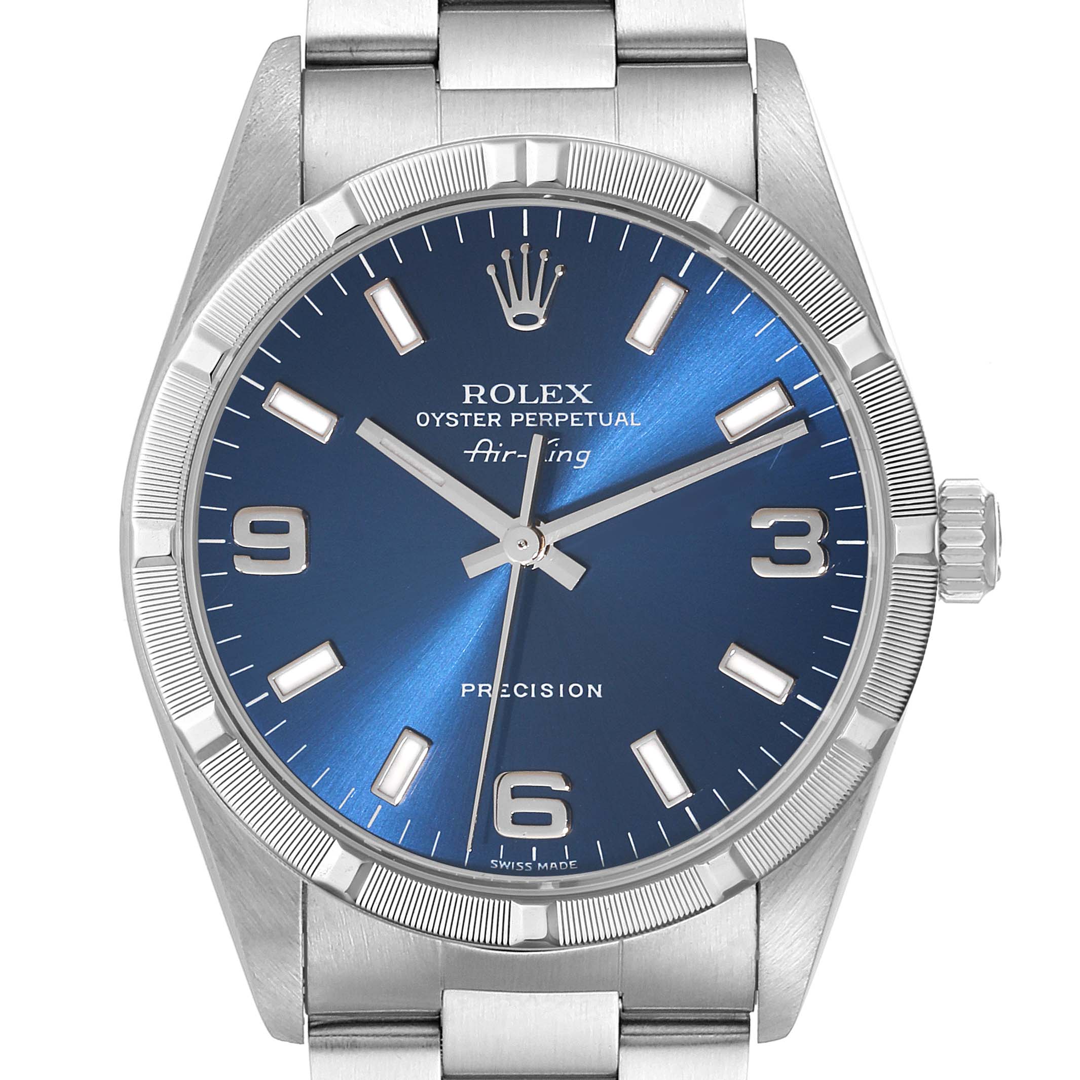 The image shows a frontal view of a Rolex Air-King 14010 Men's Stainless Steel Blue Dial 14010 Men's Stainless Steel Blue Dial watch, featuring a blue dial, silver markers, hands, and a stainless steel bracelet.