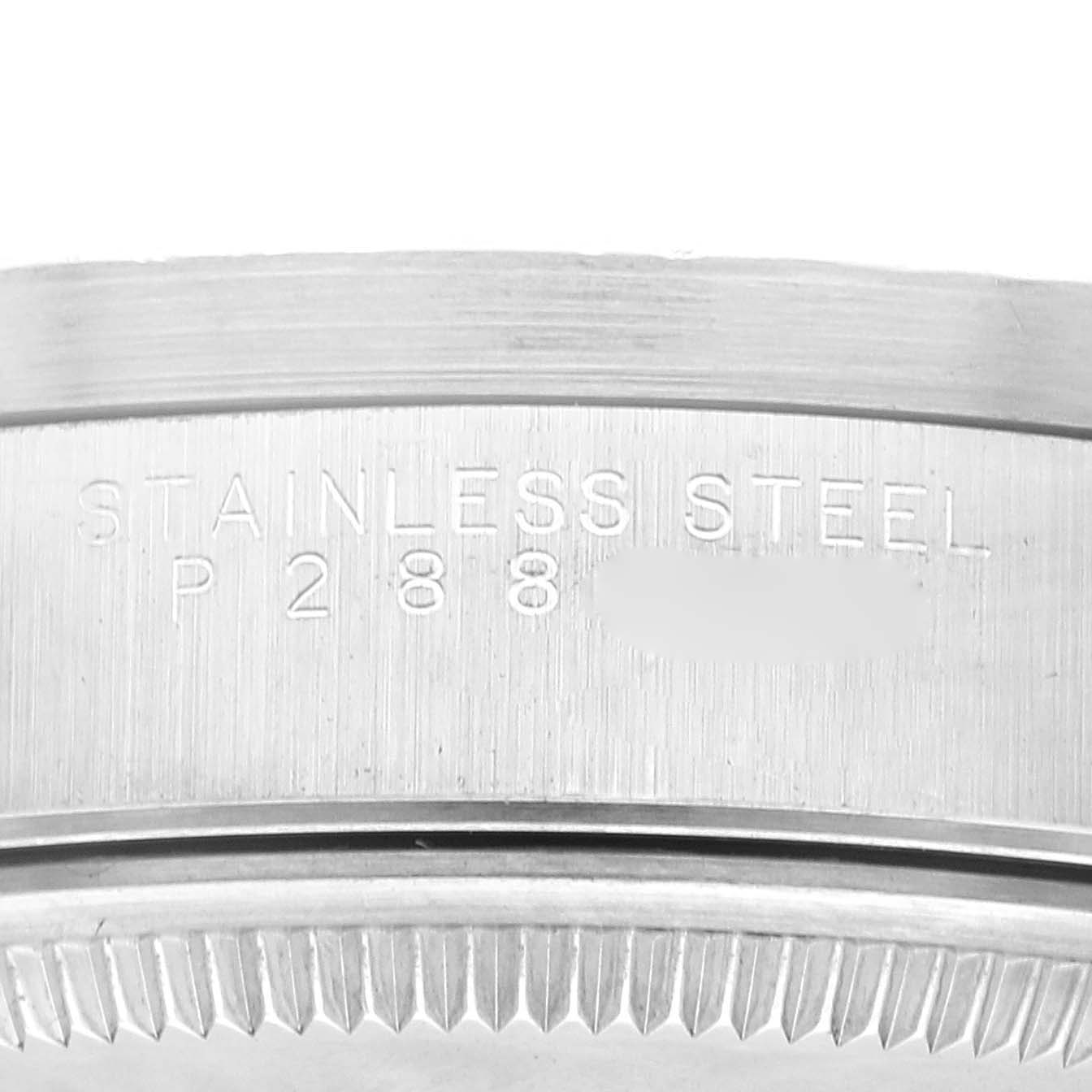 This image shows a close-up of the stainless steel case of a Rolex Air-King 14010 Men's Stainless Steel Blue Dial 14010 Men's Stainless Steel Blue Dial watch with visible engravings.