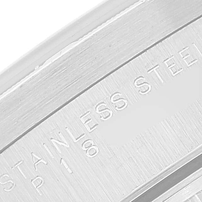 This close-up shows the stainless steel band of a Rolex Date 15210 Men
s Stainless Steel Blue Dial 15210 Men
s Stainless Steel Blue Dial watch, highlighting the engraved text.