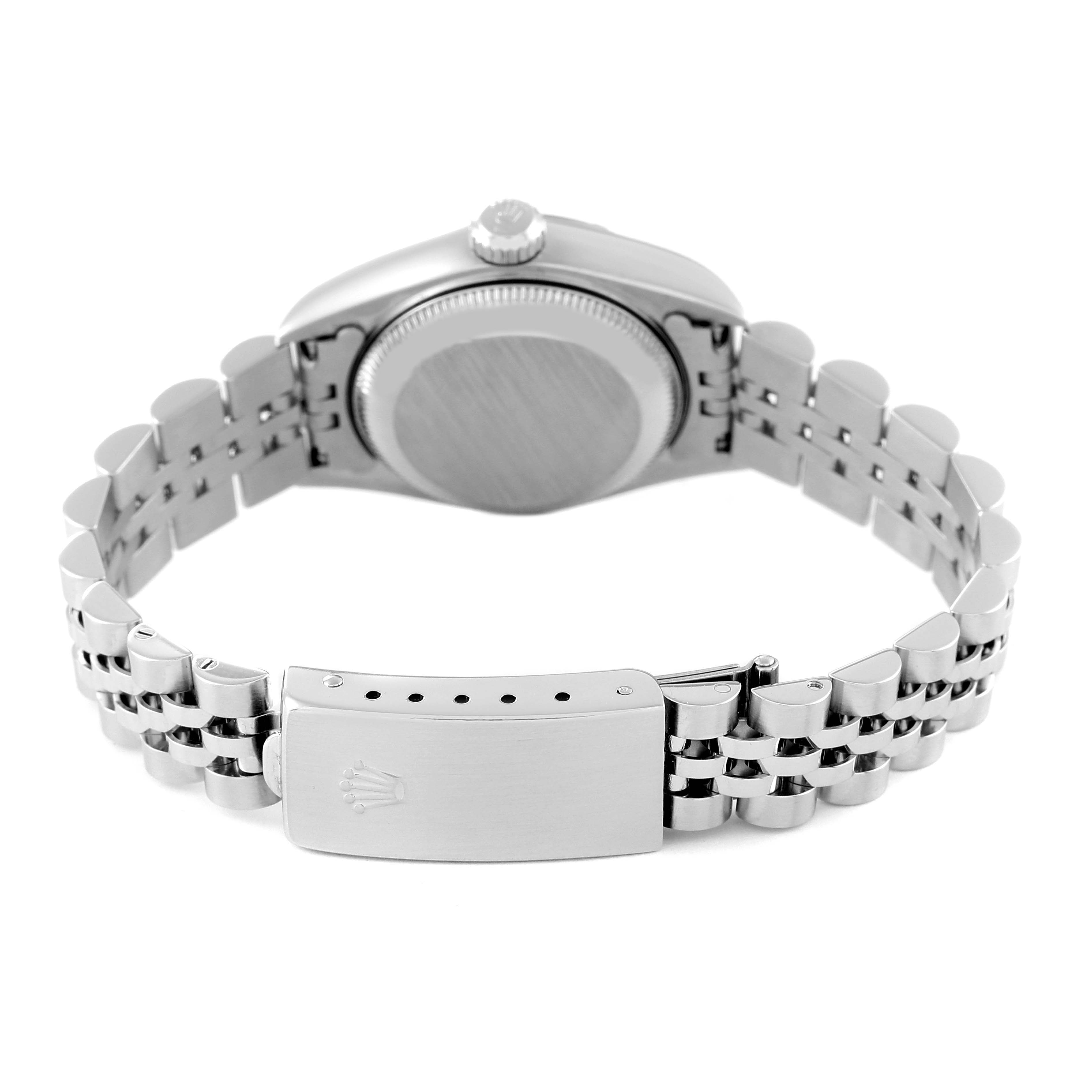 The image shows the back of a Rolex Date 79190 Women
s Stainless Steel Pink Dial 79190 Women
s Stainless Steel Pink Dial watch, highlighting the clasp and bracelet.