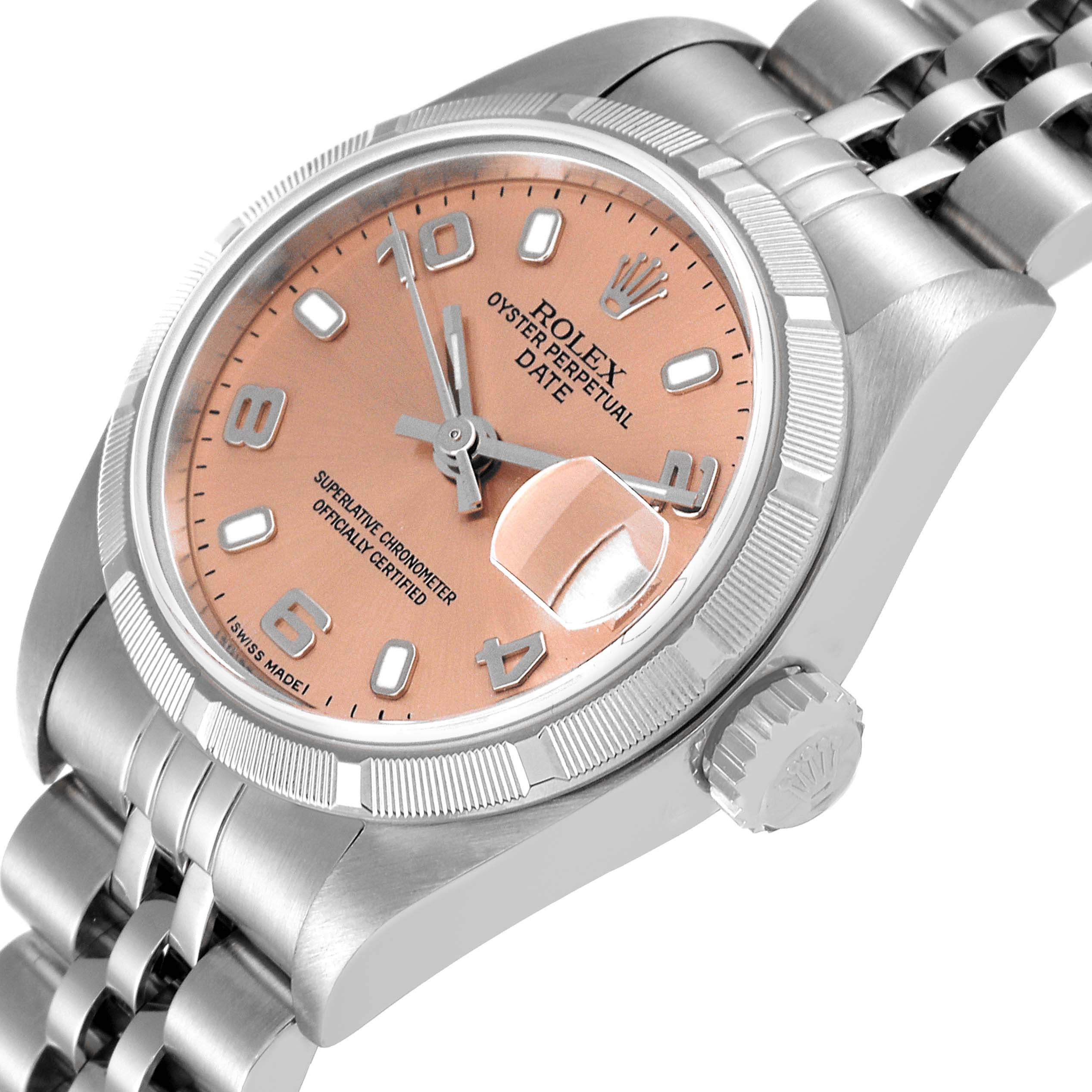 The Rolex Date 79190 Women
s Stainless Steel Pink Dial 79190 Women
s Stainless Steel Pink Dial model watch is shown from an angled view, highlighting the peach-colored dial, date magnifier, crown, and part of the bracelet.