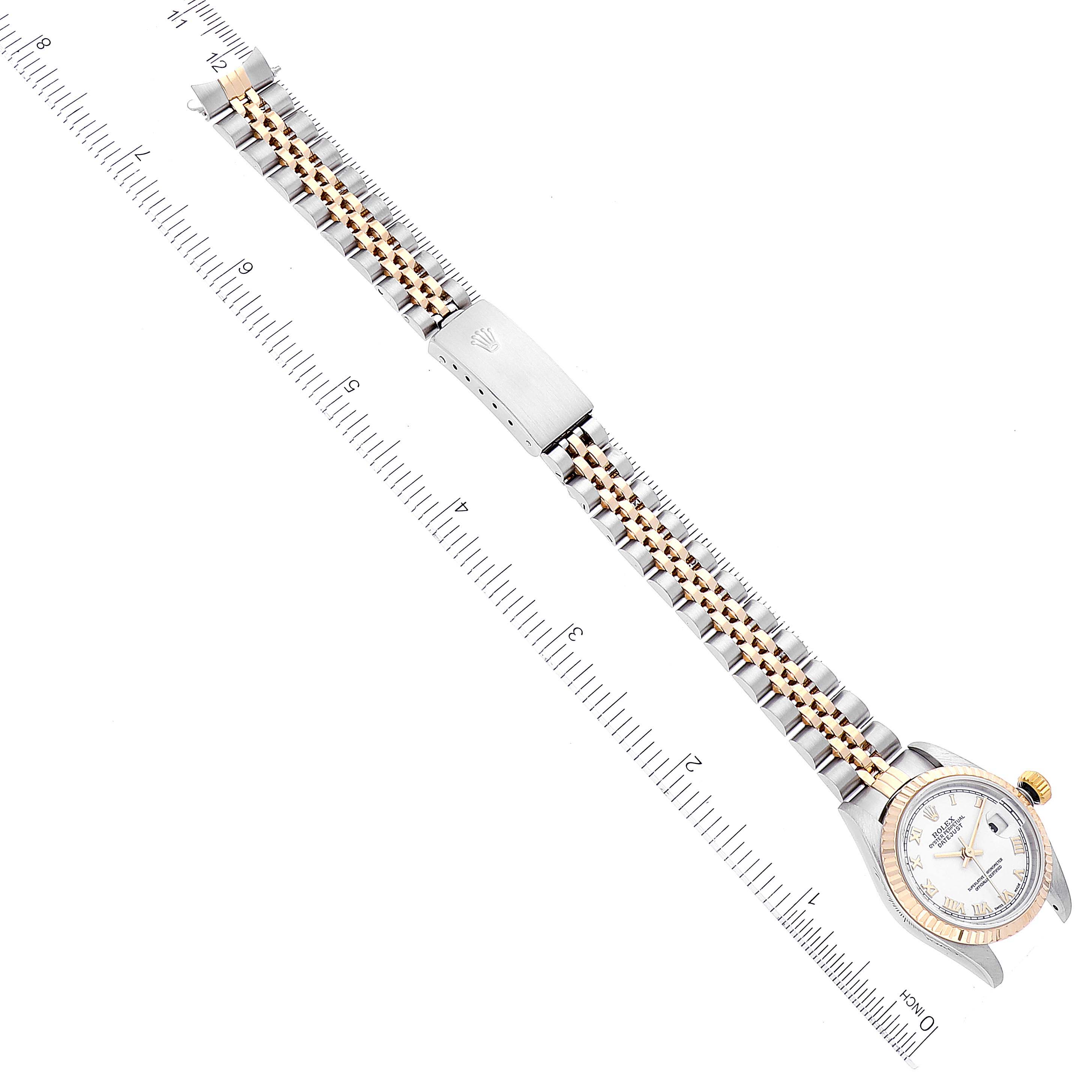 The image shows a Rolex Datejust 79173 Women's Steel and Gold (two tone) White Dial 79173 Women's Steel and Gold (two tone) White Dial watch laid flat, displaying its full band, clasp, and face from a top-down angle with measurement markings.