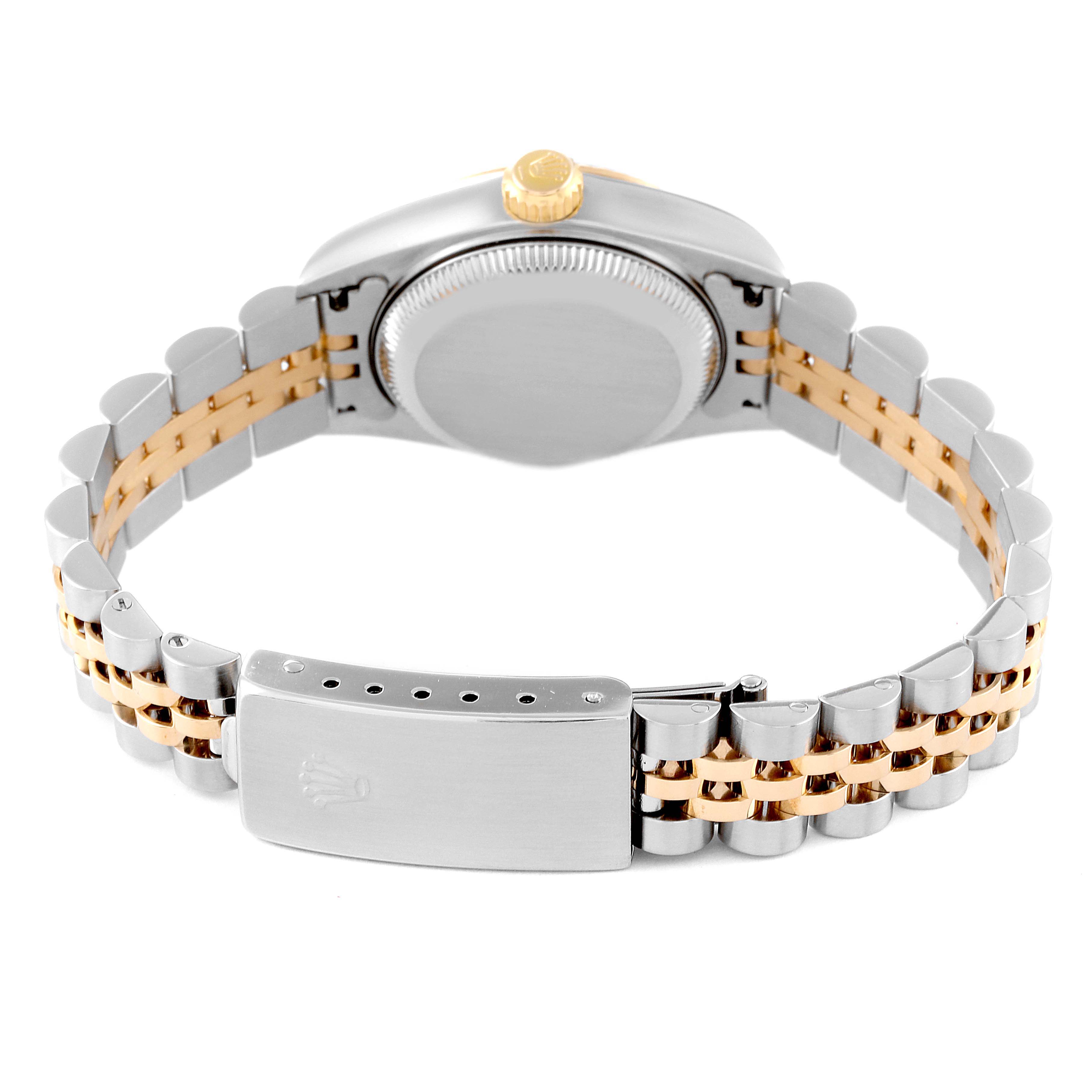 This is a rear view of the Rolex Datejust 79173 Women's Steel and Gold (two tone) White Dial 79173 Women's Steel and Gold (two tone) White Dial watch, showing the case back, the crown, and the two-tone bracelet with a clasp.