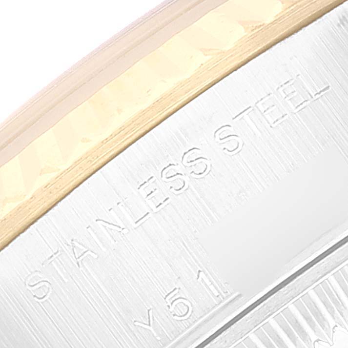 This close-up image shows part of the bezel and the "STAINLESS STEEL" engraving on the side of the Rolex Datejust 79173 Women's Steel and Gold (two tone) White Dial 79173 Women's Steel and Gold (two tone) White Dial watch.