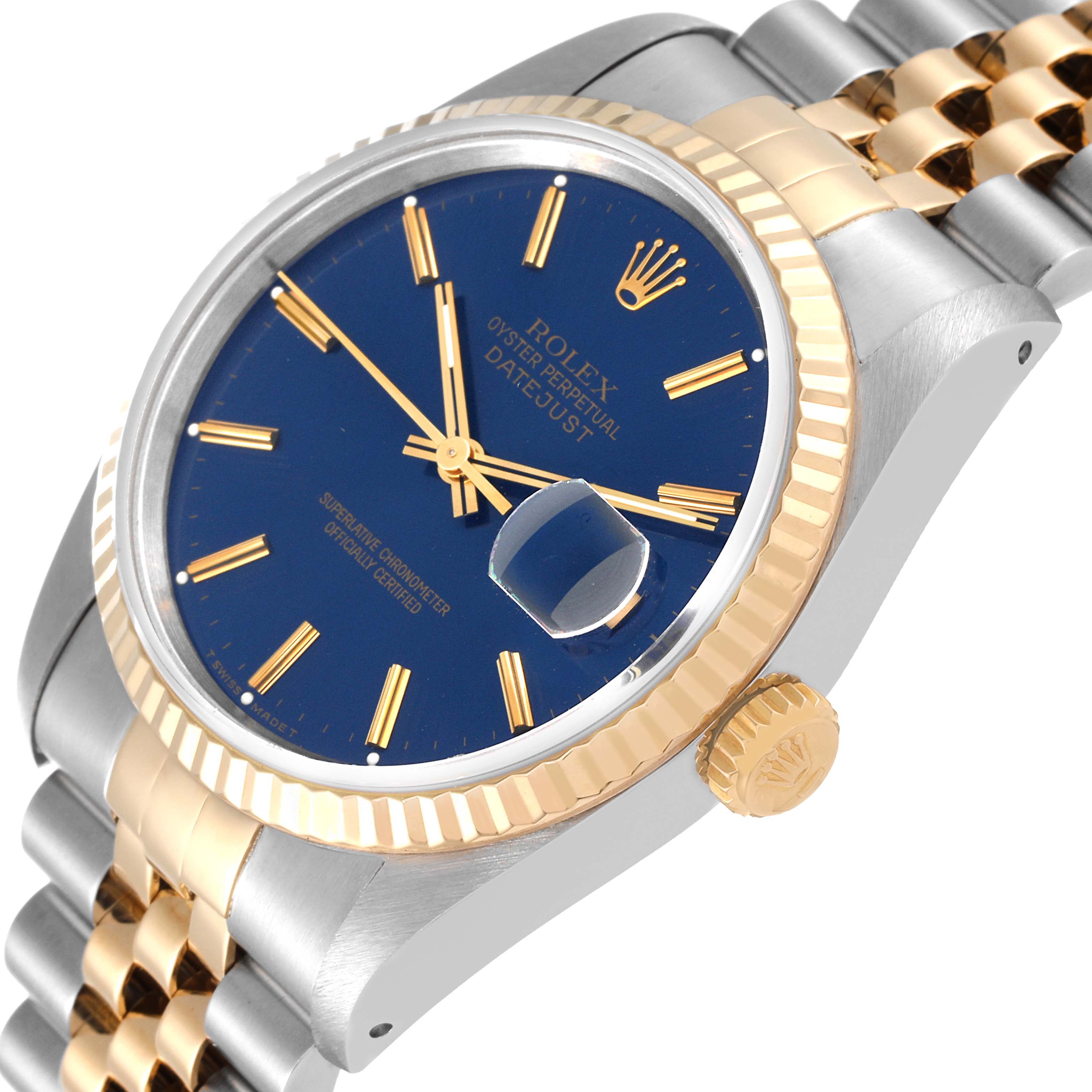 The image shows a Rolex Datejust 16233 Men's Steel and Gold (two tone) Blue Dial 16233 Men's Steel and Gold (two tone) Blue Dial watch from an angled view, featuring the dial, bezel, crown, and part of the bracelet.