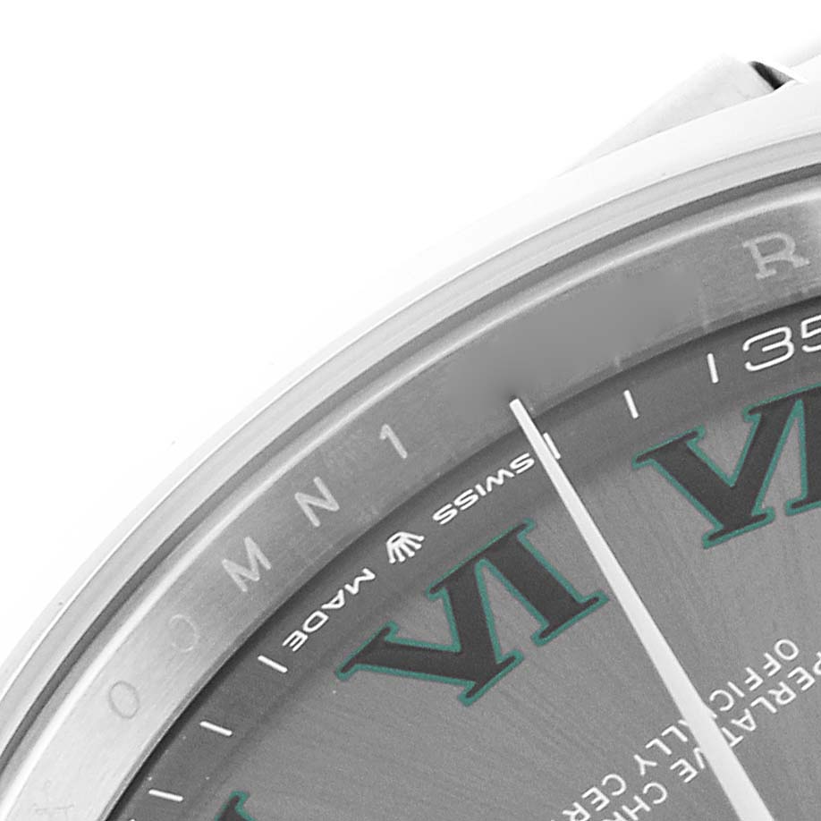 The image shows a close-up of the dial of a Rolex Datejust 41 126300 Men
s Stainless Steel Grey Dial 126300 Men
s Stainless Steel Grey Dial, featuring part of an hour marker and the "Swiss Made" text.