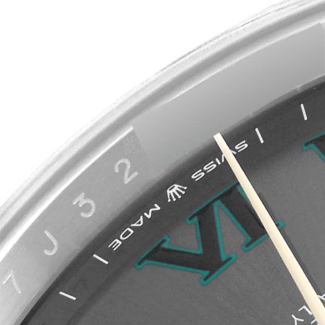 This close-up angled shot of the Datejust 41 by Rolex shows part of the dial, Swiss marking, and the top half of the Roman numeral VI.