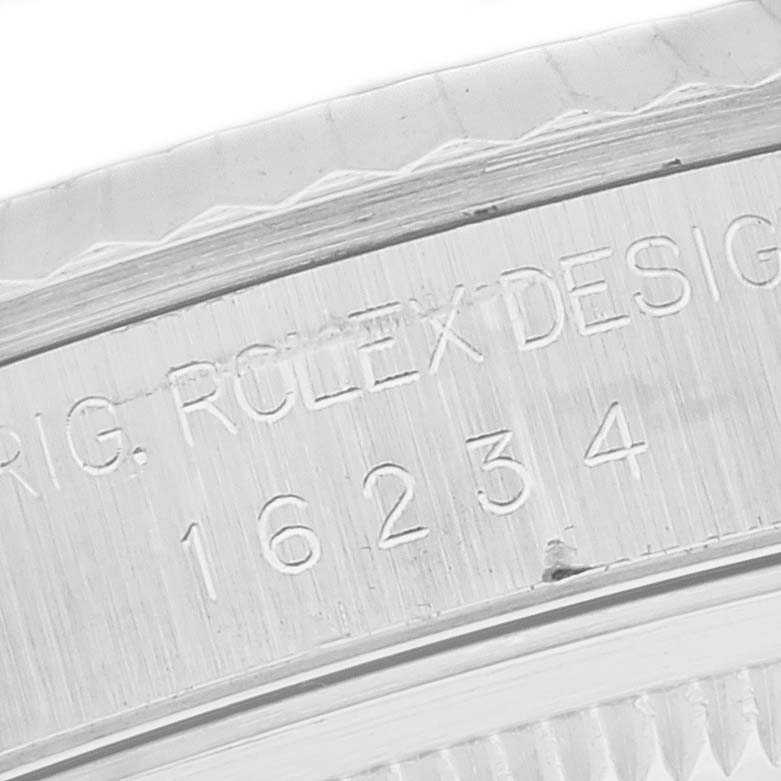 This close-up image shows the engraved model number on the case of a Rolex Datejust 16234 Men's Stainless Steel Black Dial 16234 Men's Stainless Steel Black Dial watch.