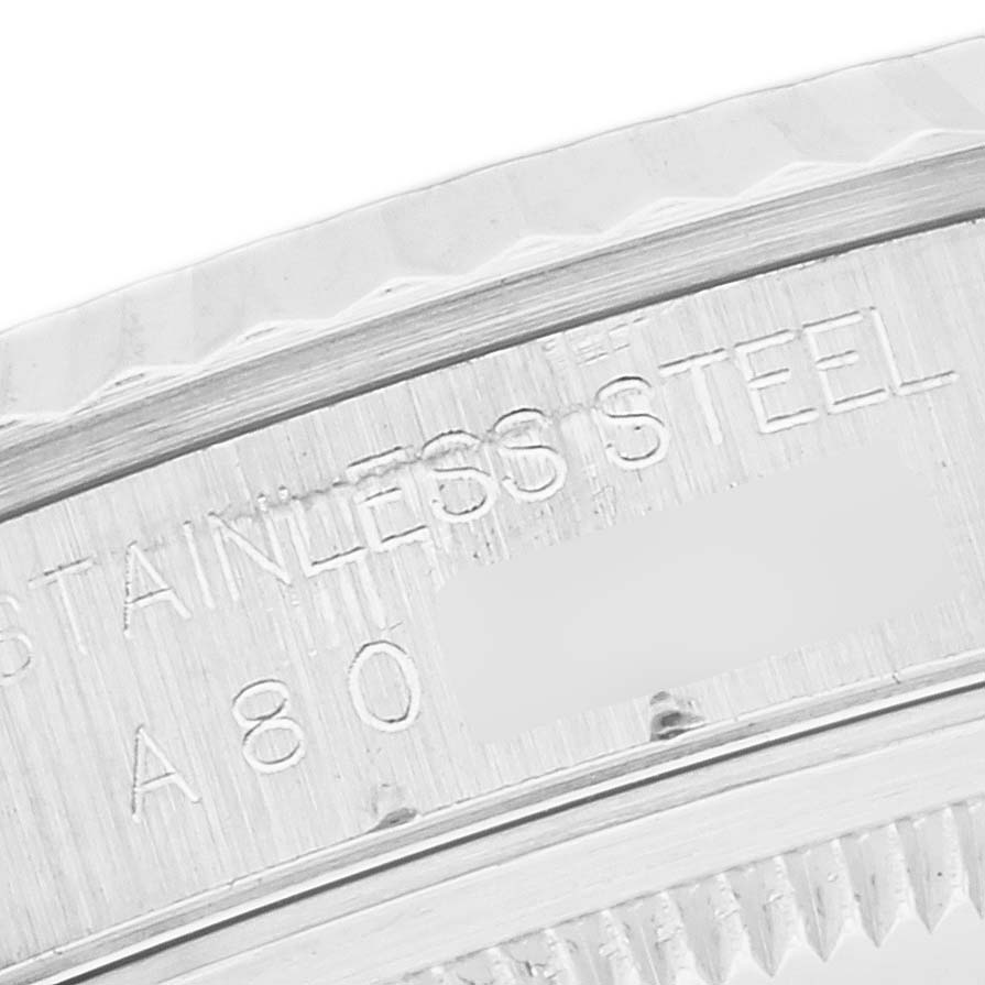 The image shows a close-up of the stainless steel bezel and part of the engraving on a Rolex Datejust 16234 Men's Stainless Steel Black Dial 16234 Men's Stainless Steel Black Dial watch.