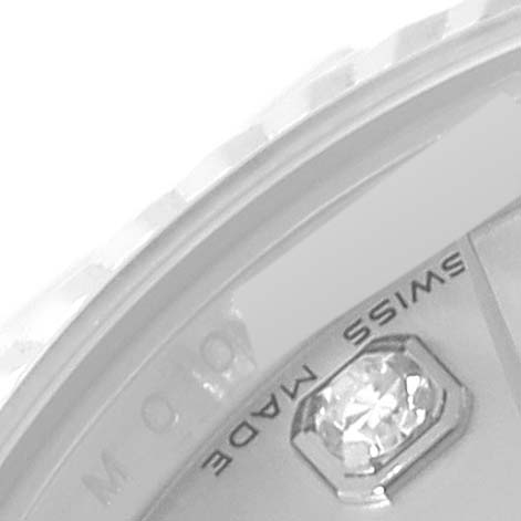 The image shows a close-up of the Rolex Datejust 179174 Women's Stainless Steel Silver Dial 179174 Women's Stainless Steel Silver Dial model's dial, including the edge of the bezel, part of a diamond index, and "Swiss Made" text.
