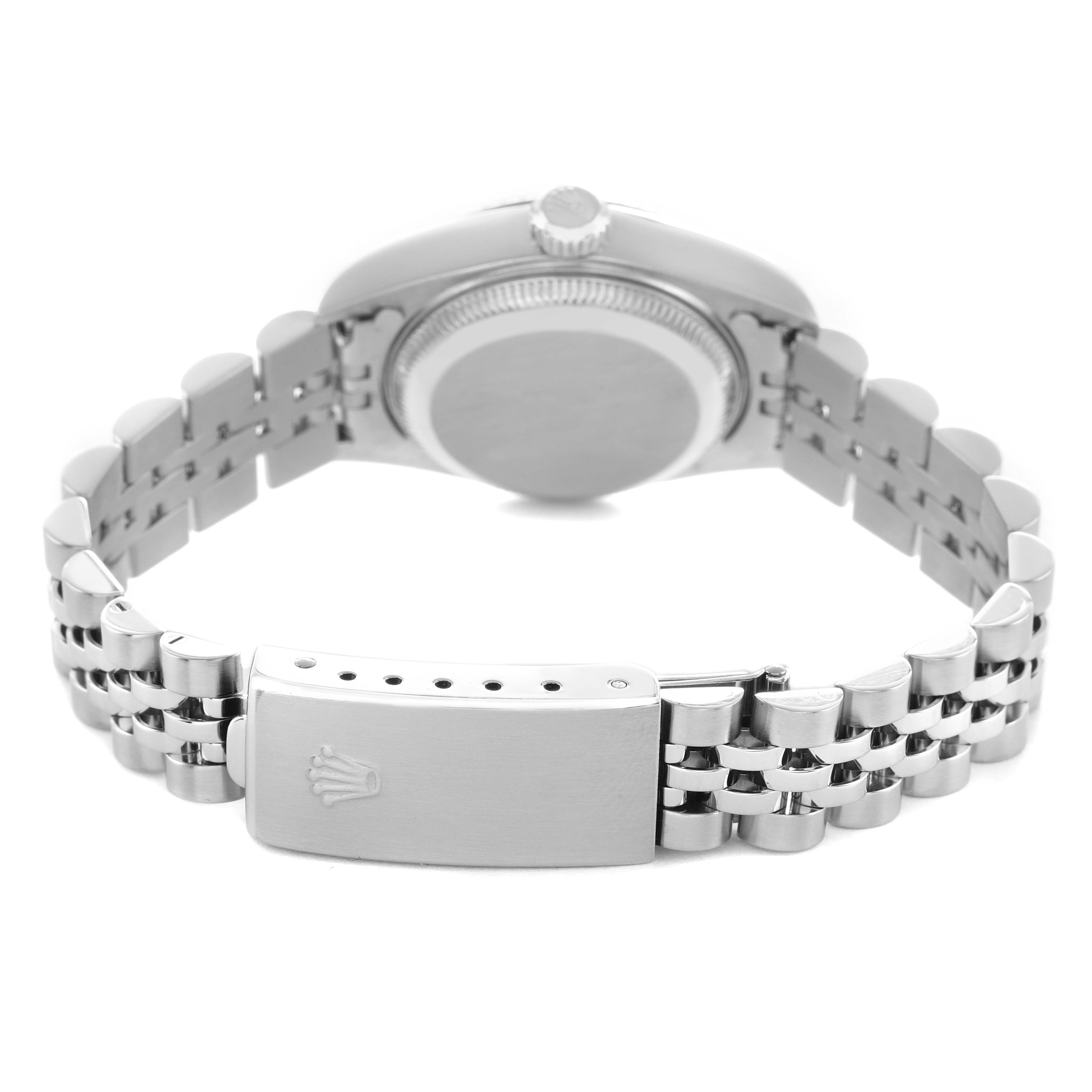 The image shows a Rolex Datejust 79174 Women's Stainless Steel White Dial watch from a rear angle highlighting the case back, crown, and Jubilee bracelet with clasp.