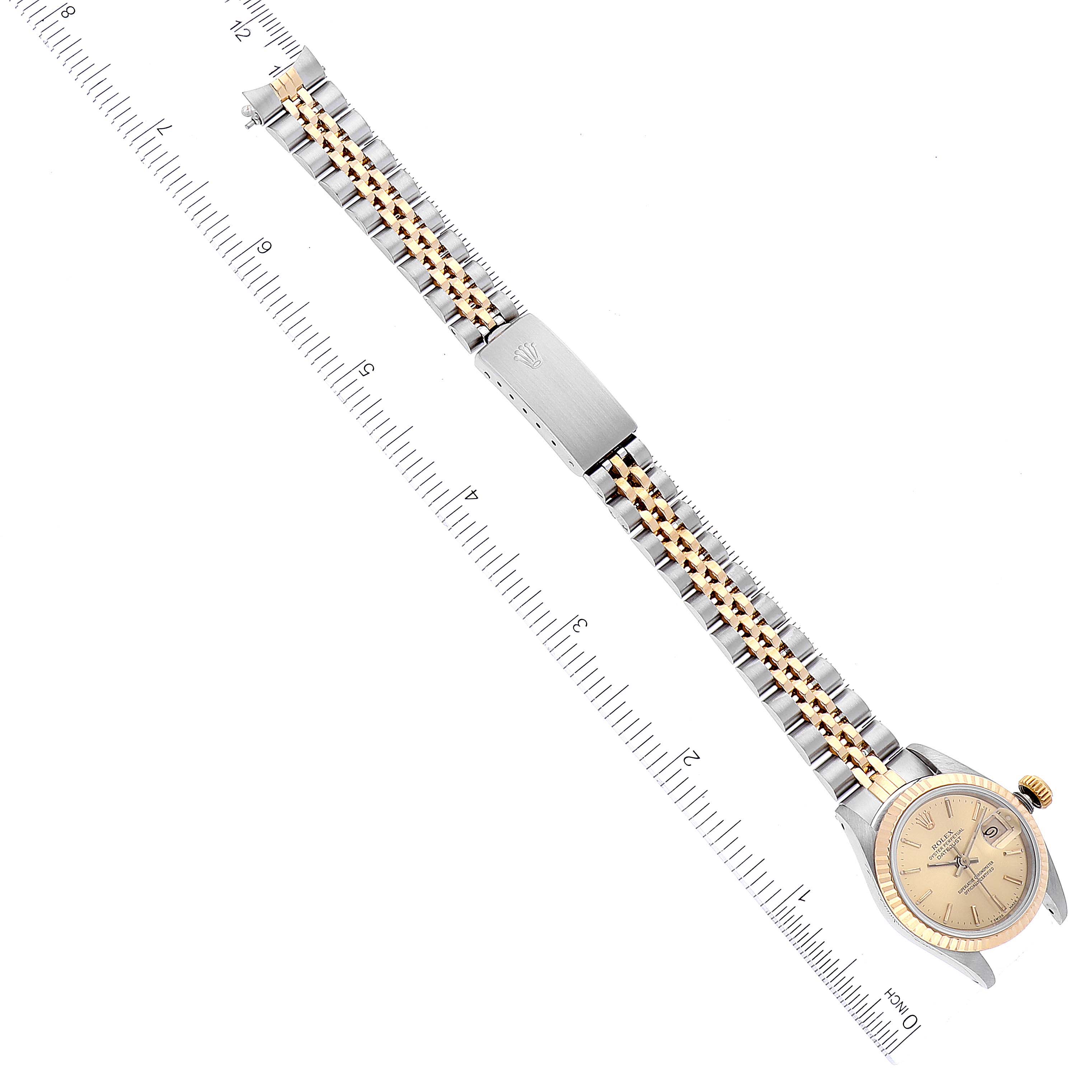 This image shows a top-down view of a Rolex Datejust 69173 Women's Steel and Gold (two tone) Champagne Dial 69173 Women's Steel and Gold (two tone) Champagne Dial watch, highlighting the face, bezel, crown, and two-tone bracelet.