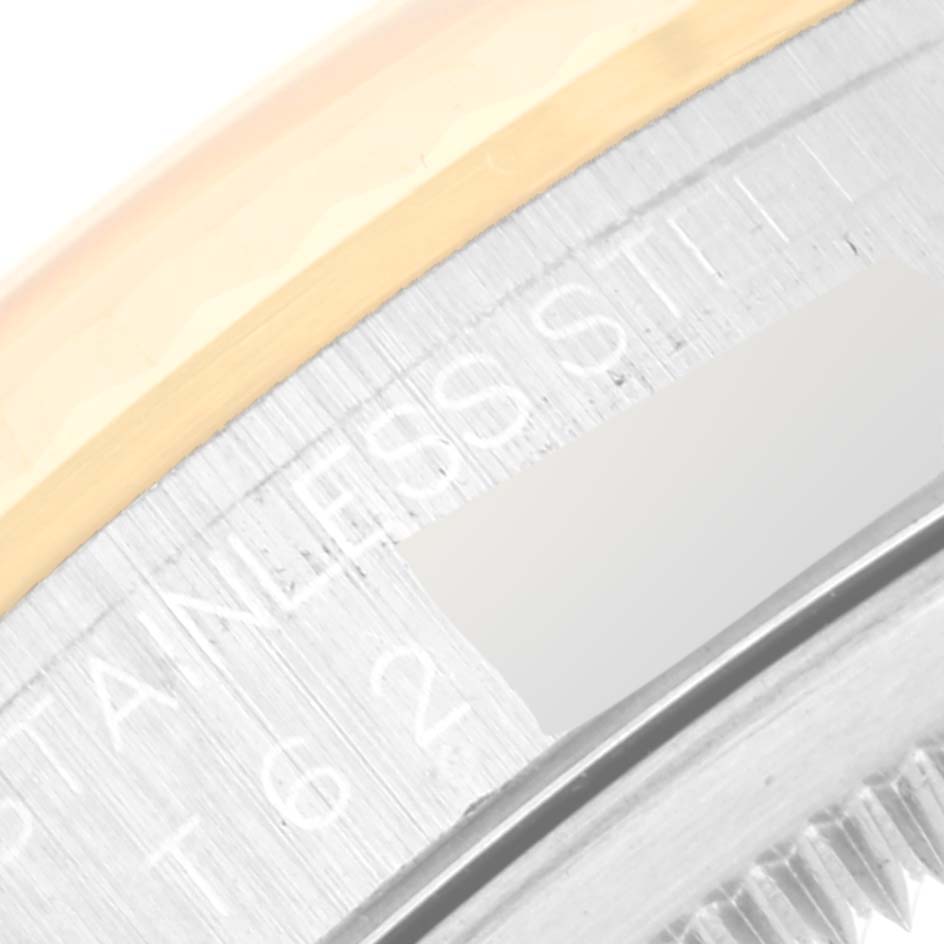 This close-up image shows part of the bezel and the engraved inner ring of a Rolex Datejust 16233 Men's Steel and Gold (two tone) Champagne Dial 16233 Men's Steel and Gold (two tone) Champagne Dial watch.