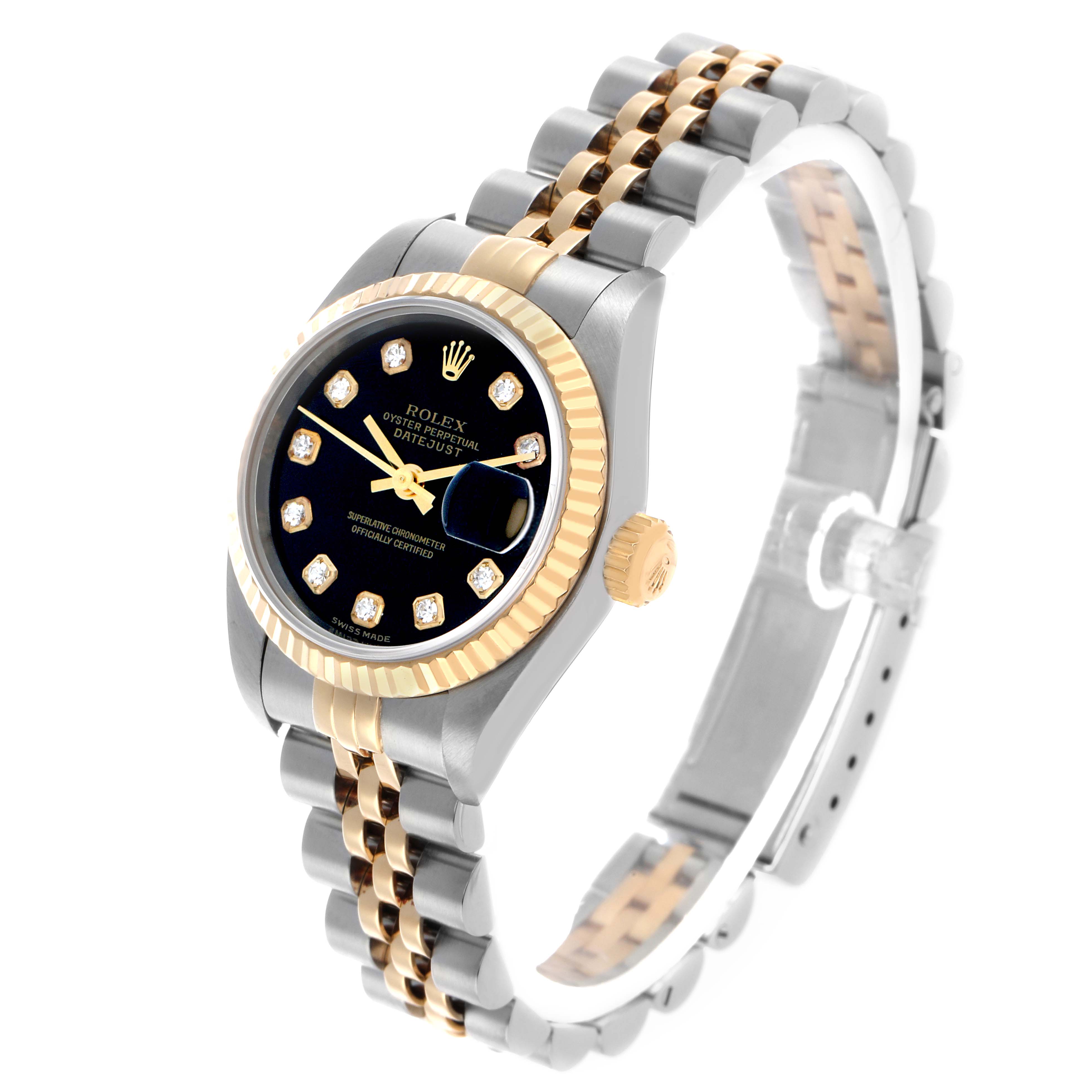 The image shows a Rolex Datejust 79173 Women's Steel and Gold (two tone) Black Dial watch at a three-quarter angle, highlighting its bezel, dial, crown, and two-tone bracelet.
