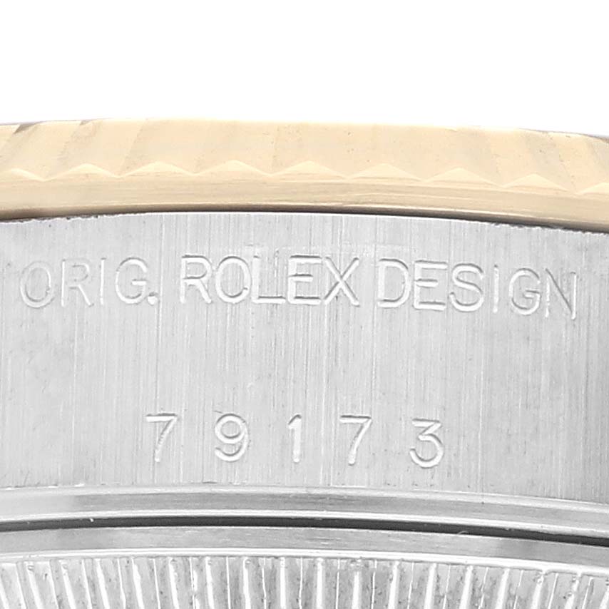 The image shows the side of a Rolex Datejust 79173 Women's Steel and Gold (two tone) Black Dial watch, highlighting the engraved model number "79173" and "Orig. Rolex Design" inscription.