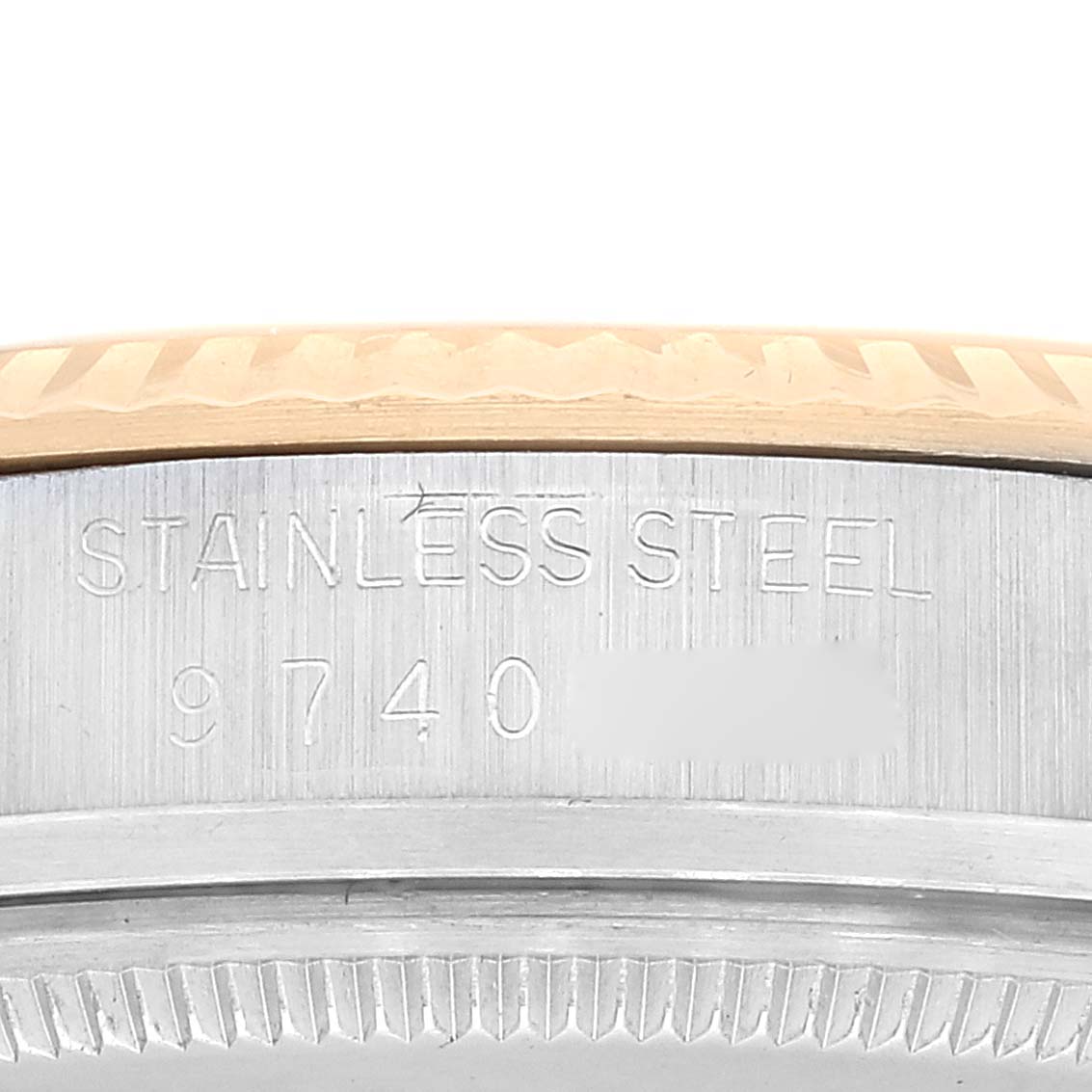 This image displays the side view of the case back of a Vintage Collection Rolex watch, showcasing its stainless steel material and model number.