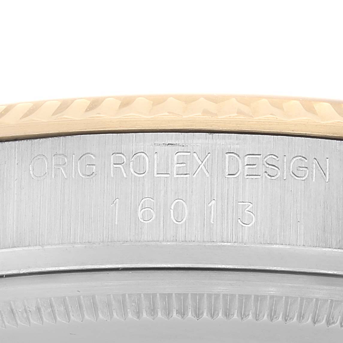 This image shows a close-up of the Rolex Vintage Collection 16013 Men's Steel and Gold (two tone) Champagne Dial 16013 Men's Steel and Gold (two tone) Champagne Dial model 16013, focusing on the bezel and case with visible engravings.