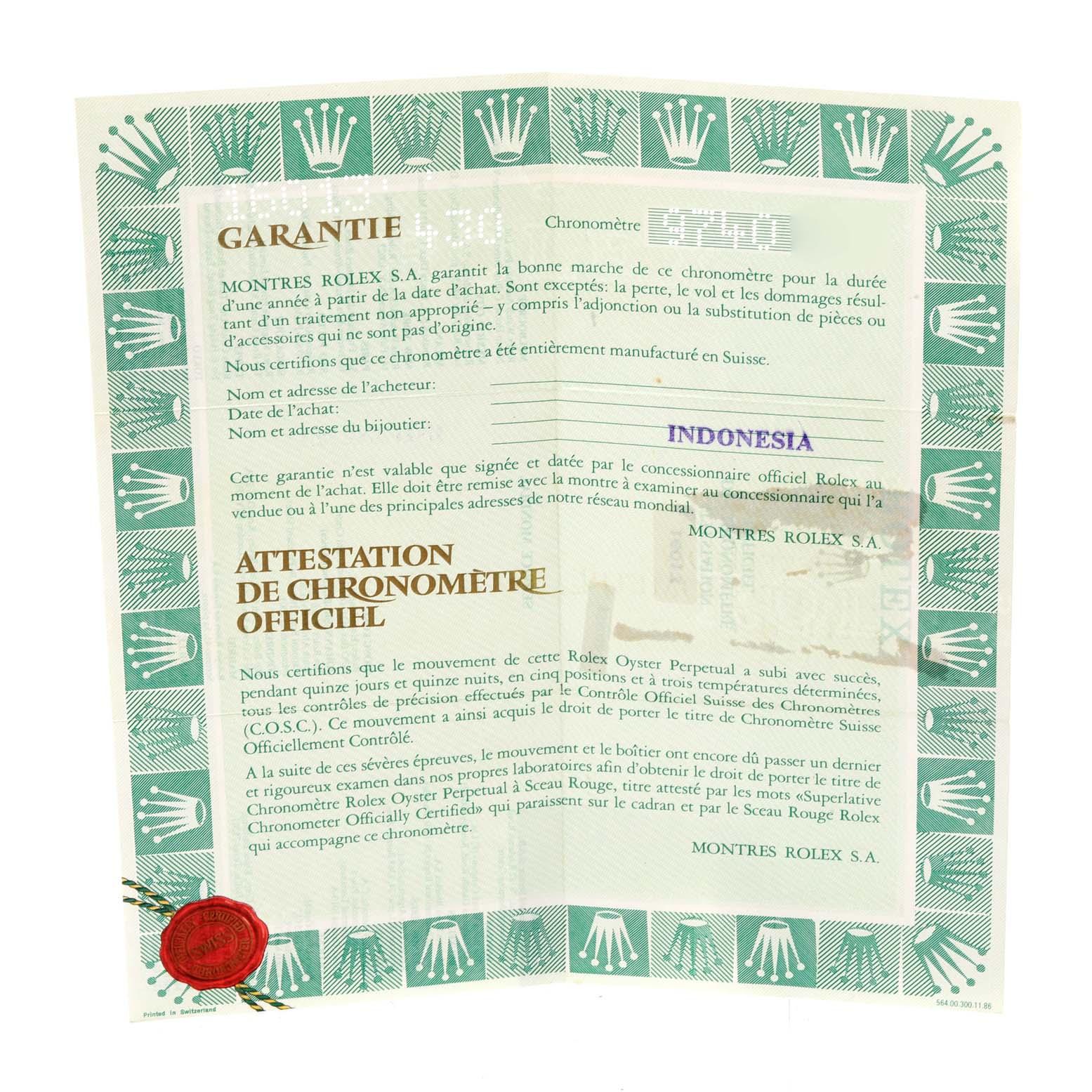 This image shows a warranty and chronometer certification for the Vintage Collection model by Rolex, from a top-down angle.