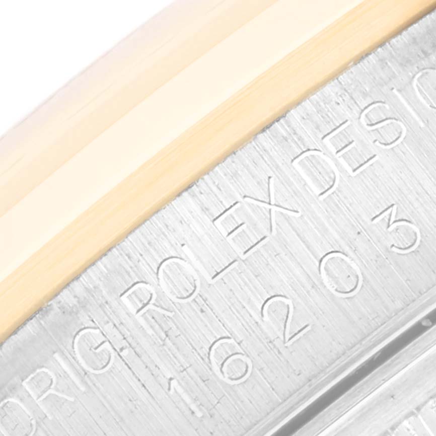 This close-up image shows the engraved model number on the side of the case of a Rolex Datejust 16203 Men's Steel and Gold (two tone) Mother of Pearl Dial 16203 Men's Steel and Gold (two tone) Mother of Pearl Dial watch.