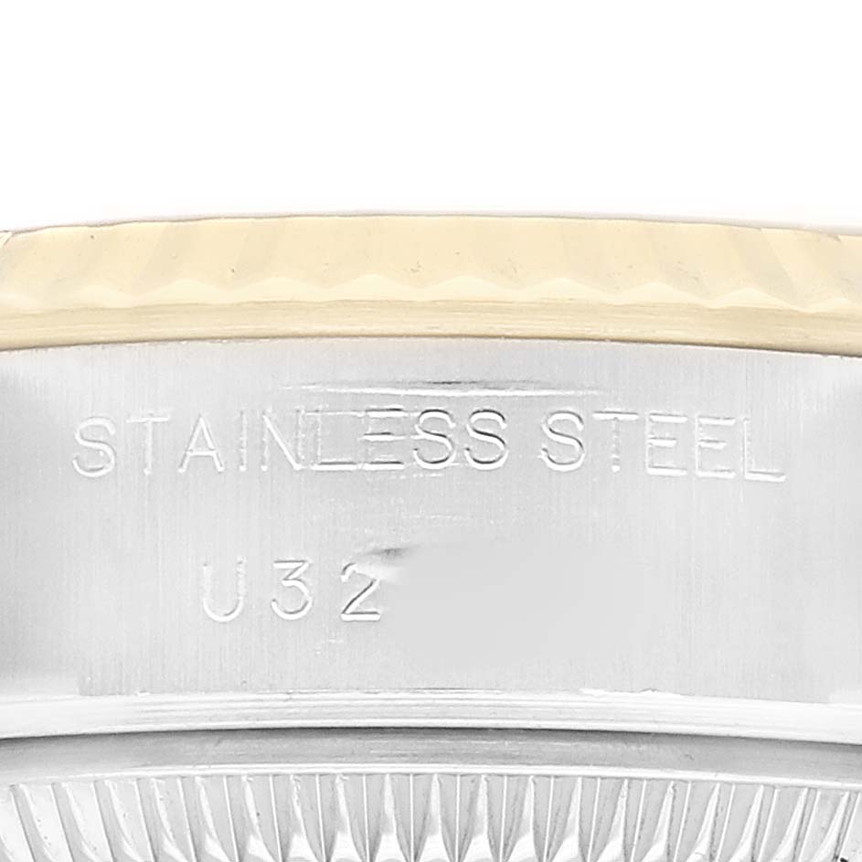 The image shows a close-up of the side of a Rolex Datejust 69173 Women's Stainless Steel White Dial, highlighting the metal casing and engraved markings.