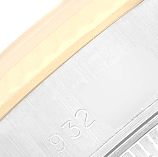 This close-up image shows part of the metal bracelet and case of a Rolex Datejust 69173 Women's Steel and Gold (two tone) White Dial 69173 Women's Steel and Gold (two tone) White Dial watch.