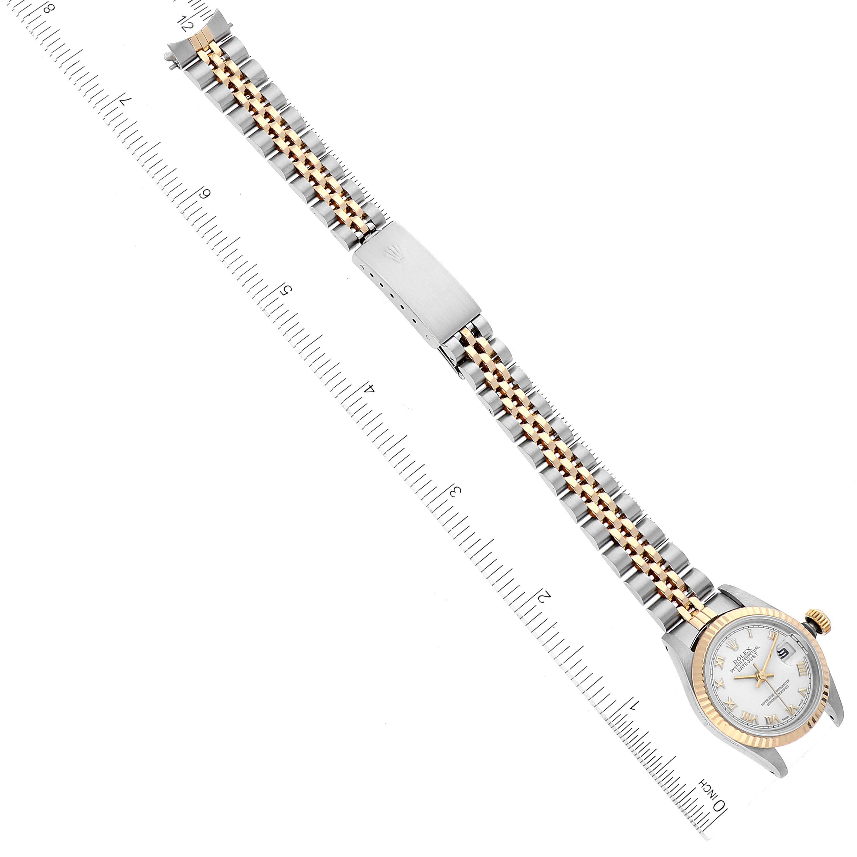 The Rolex Datejust 69173 Women's Steel and Gold (two tone) White Dial 69173 Women's Steel and Gold (two tone) White Dial watch is shown from an overhead angle, displaying its face, band, and clasp.