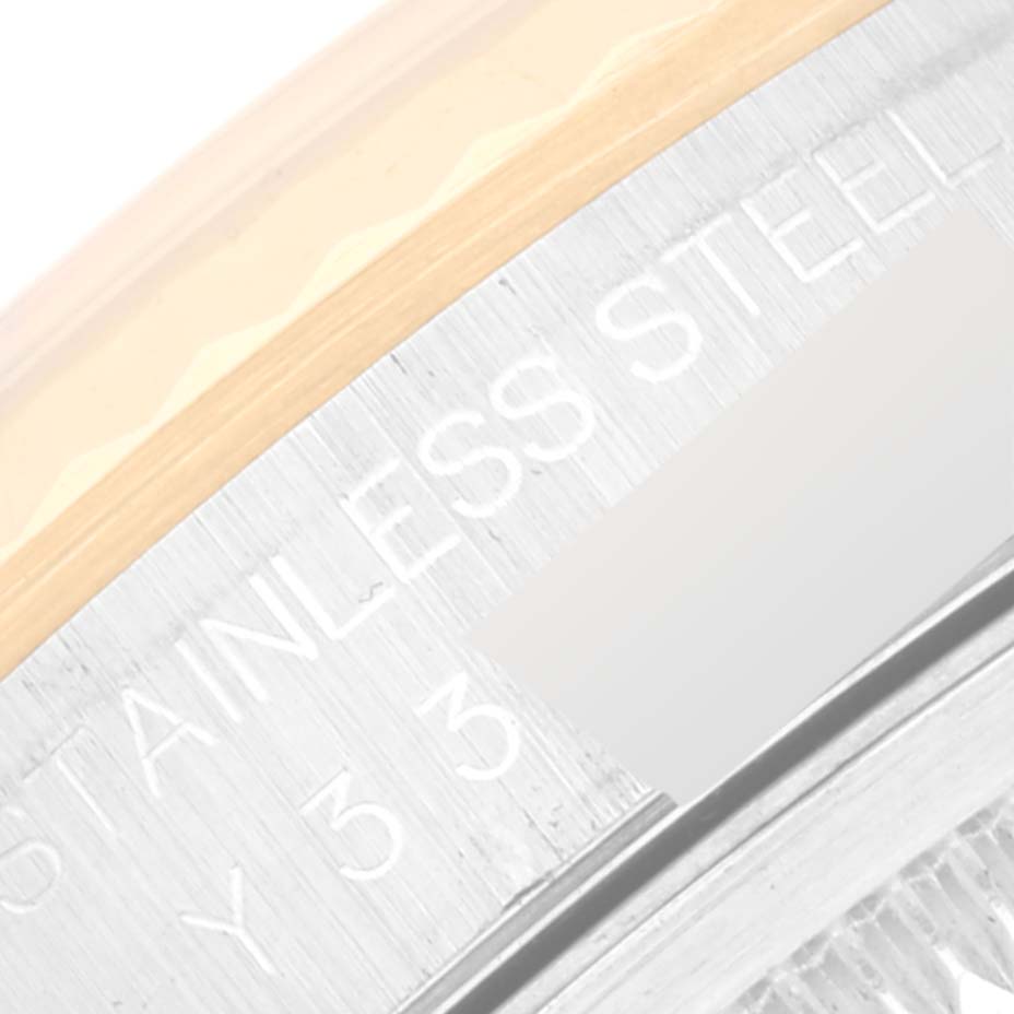 The image shows a close-up of the bezel and part of the case with "STAINLESS STEEL" engraved on the Rolex Datejust 16233 Men's Steel and Gold (two tone) White Dial 16233 Men's Steel and Gold (two tone) White Dial watch.