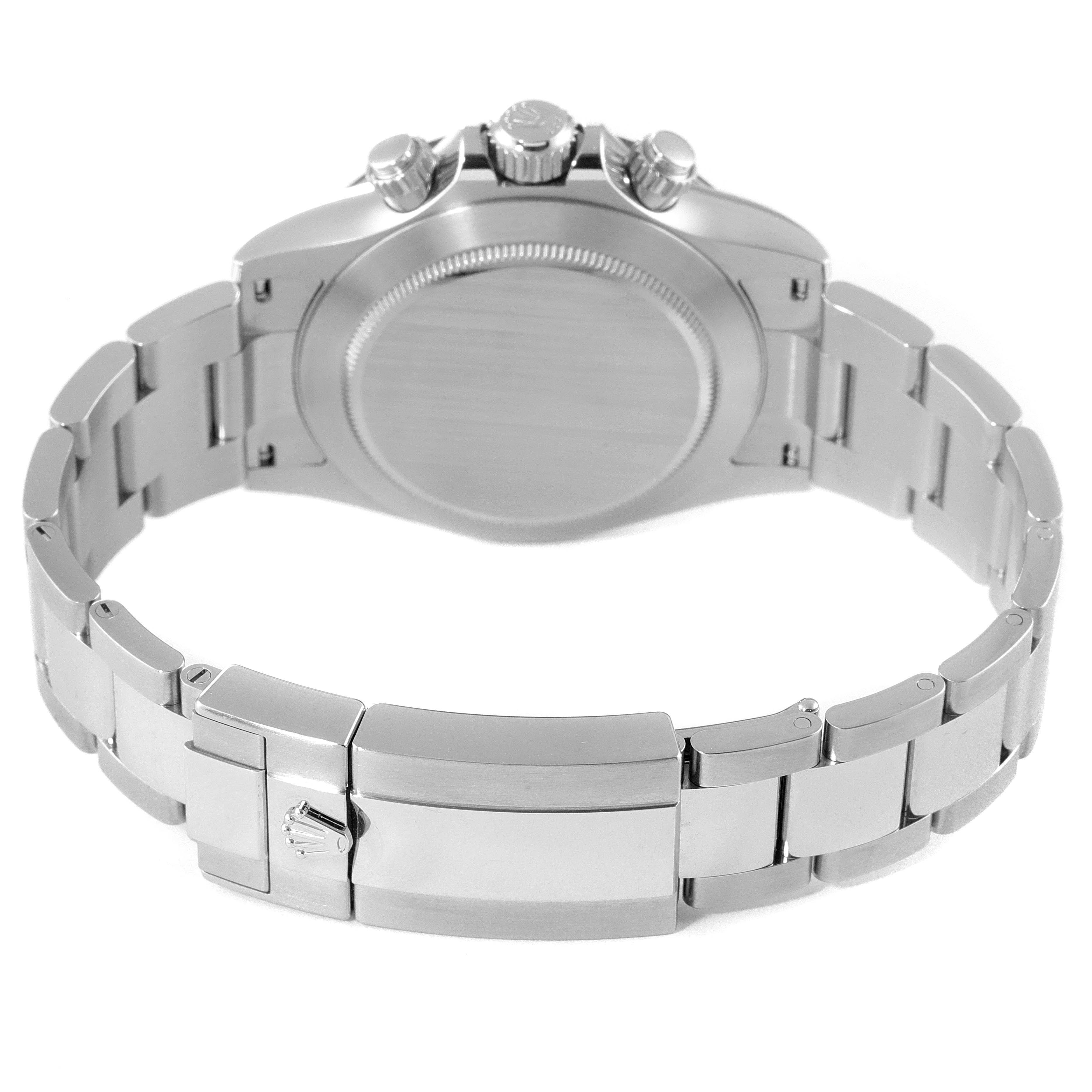 The image shows the back view of a Rolex Daytona 116500 Men's Stainless Steel White Dial 116500 Men's Stainless Steel White Dial watch, highlighting the case back, crown, pushers, and part of the metal bracelet.