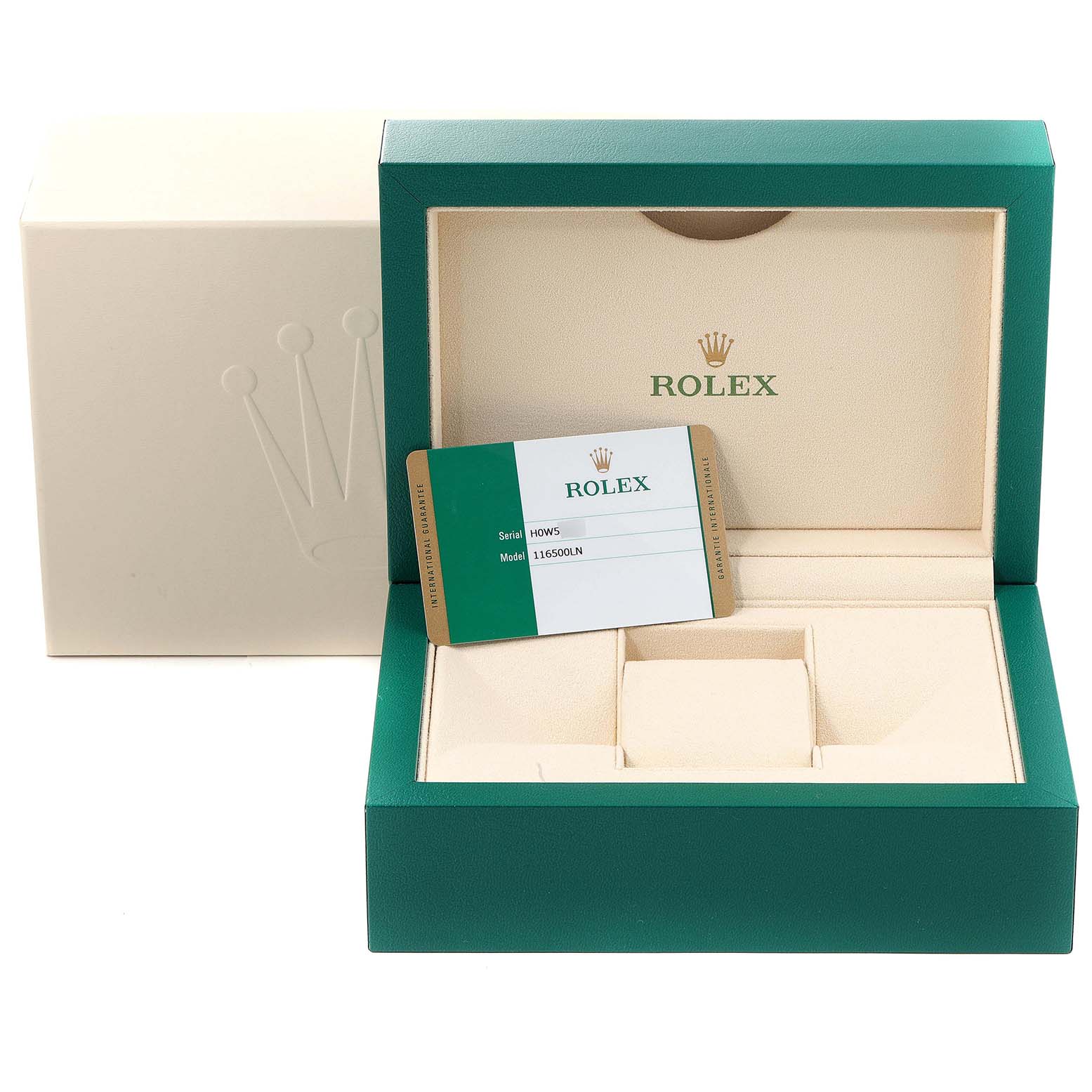 The image shows an open green and beige Rolex box with a warranty card for the Daytona model.