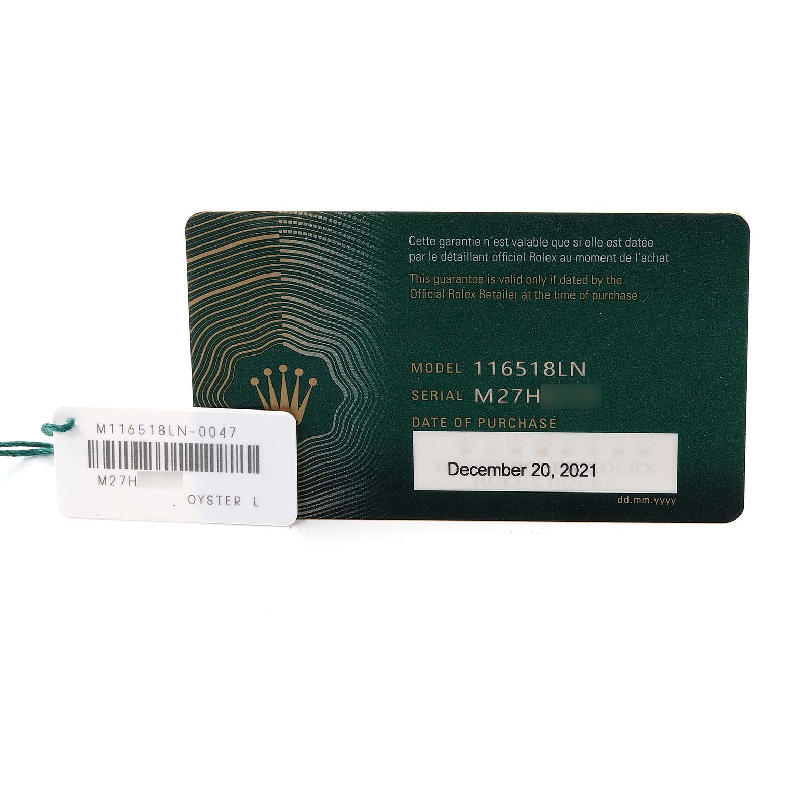 This image shows the warranty card and tag for a Rolex Daytona 116518LN Men's Yellow Gold Black Dial 116518LN Men's Yellow Gold Black Dial model 116518LN, including the purchase date of December 20, 2021.