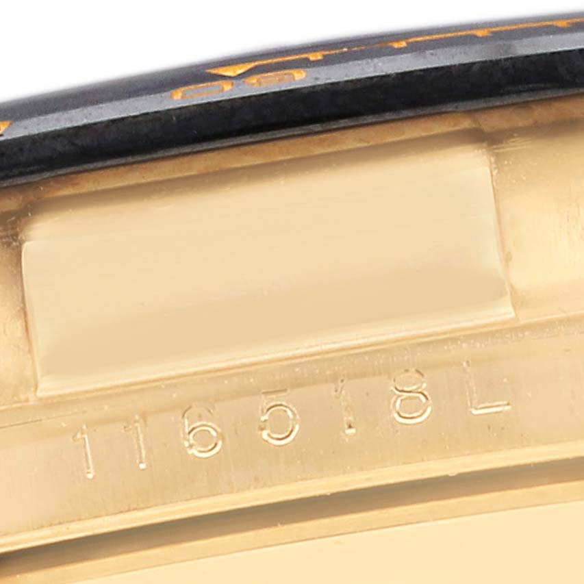 The image shows a close-up of the serial number engraving on the side of a Rolex Daytona 116518LN Men's Yellow Gold Black Dial 116518LN Men's Yellow Gold Black Dial watch case.