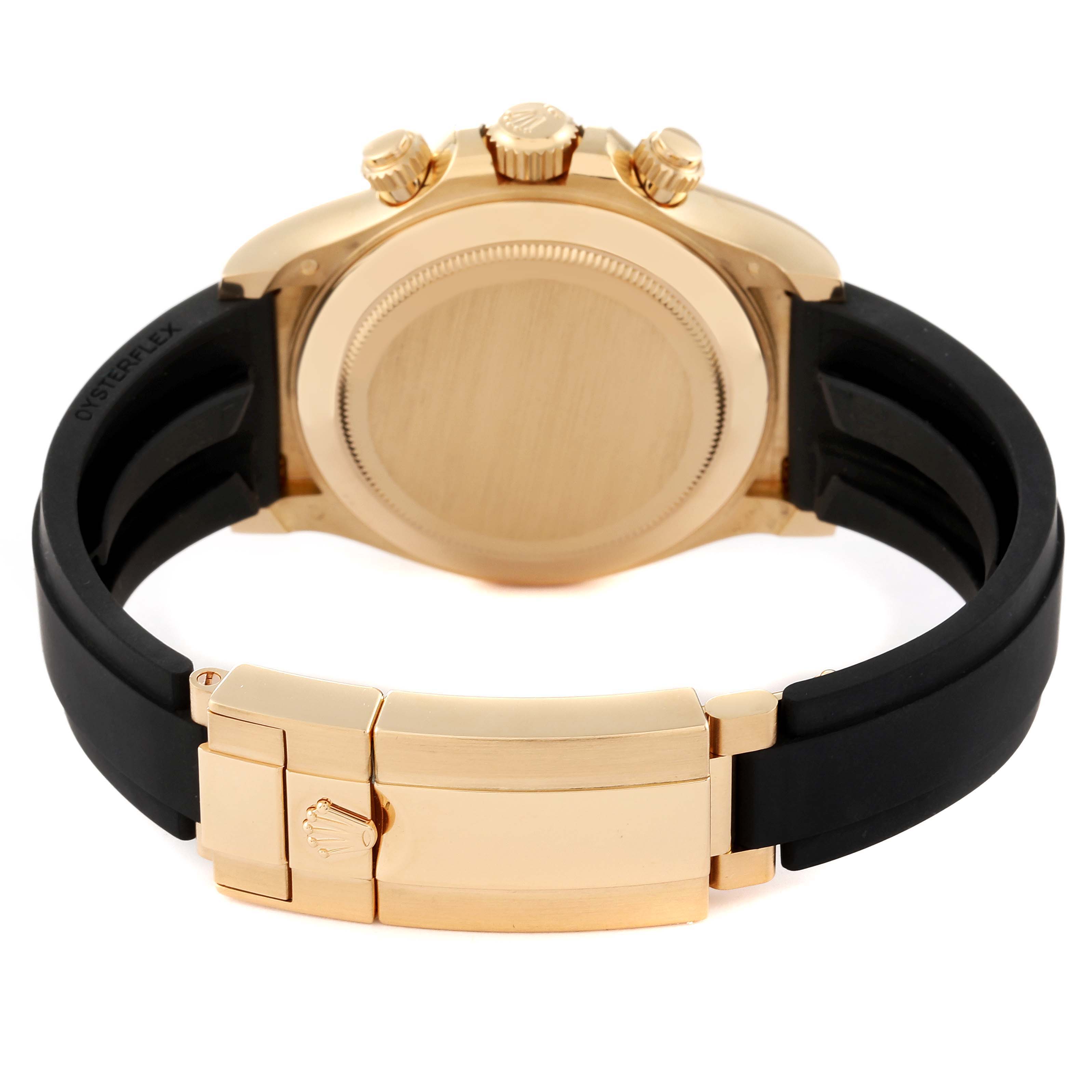 The image shows the back view of a Rolex Daytona 116518LN Men's Yellow Gold Black Dial 116518LN Men's Yellow Gold Black Dial watch with its clasp, pushers, and black Oysterflex strap.