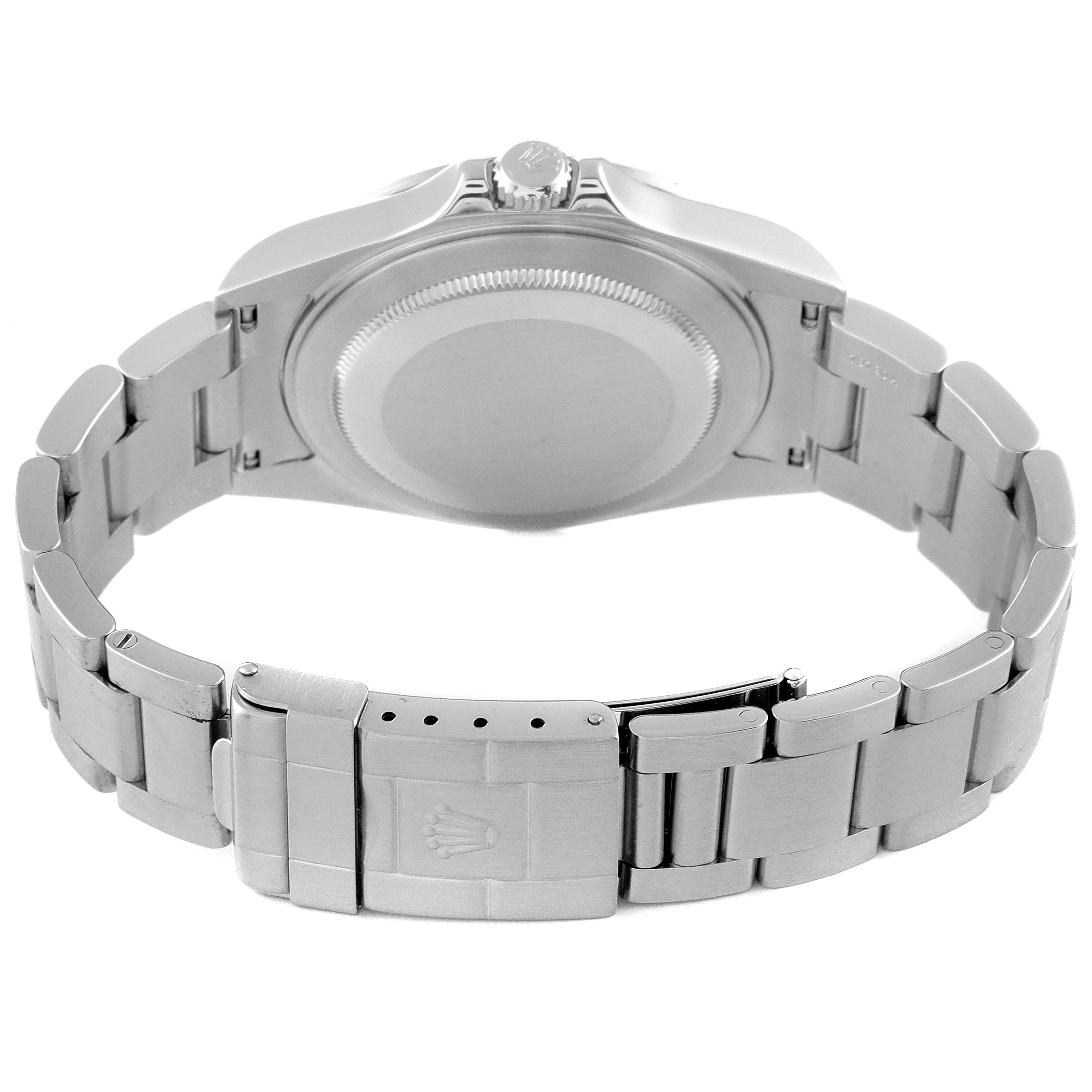 The image shows the back and bracelet of the Rolex Explorer 16570 Men's Stainless Steel White Dial 16570 Men's Stainless Steel White Dial watch, including the clasp with the Rolex logo.